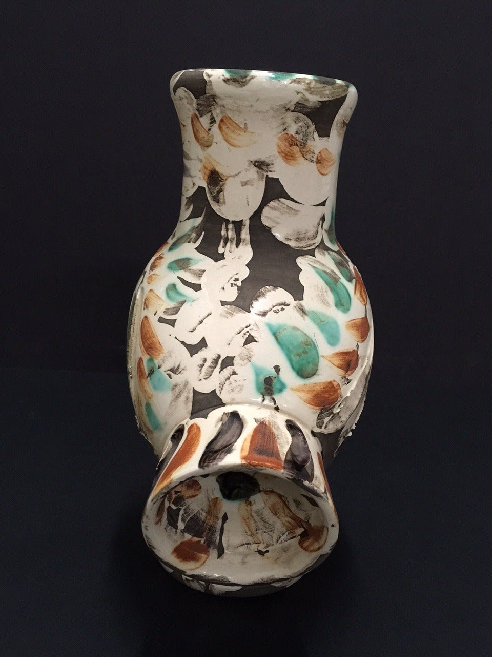 Pablo Picasso Original Ceramic Vase, made of white earthenware clay, hand- painted with black, red, white, green and grey.From the edition of 350. Inscribed Madoura/Edition Picasso on verso. 

(AR 602)