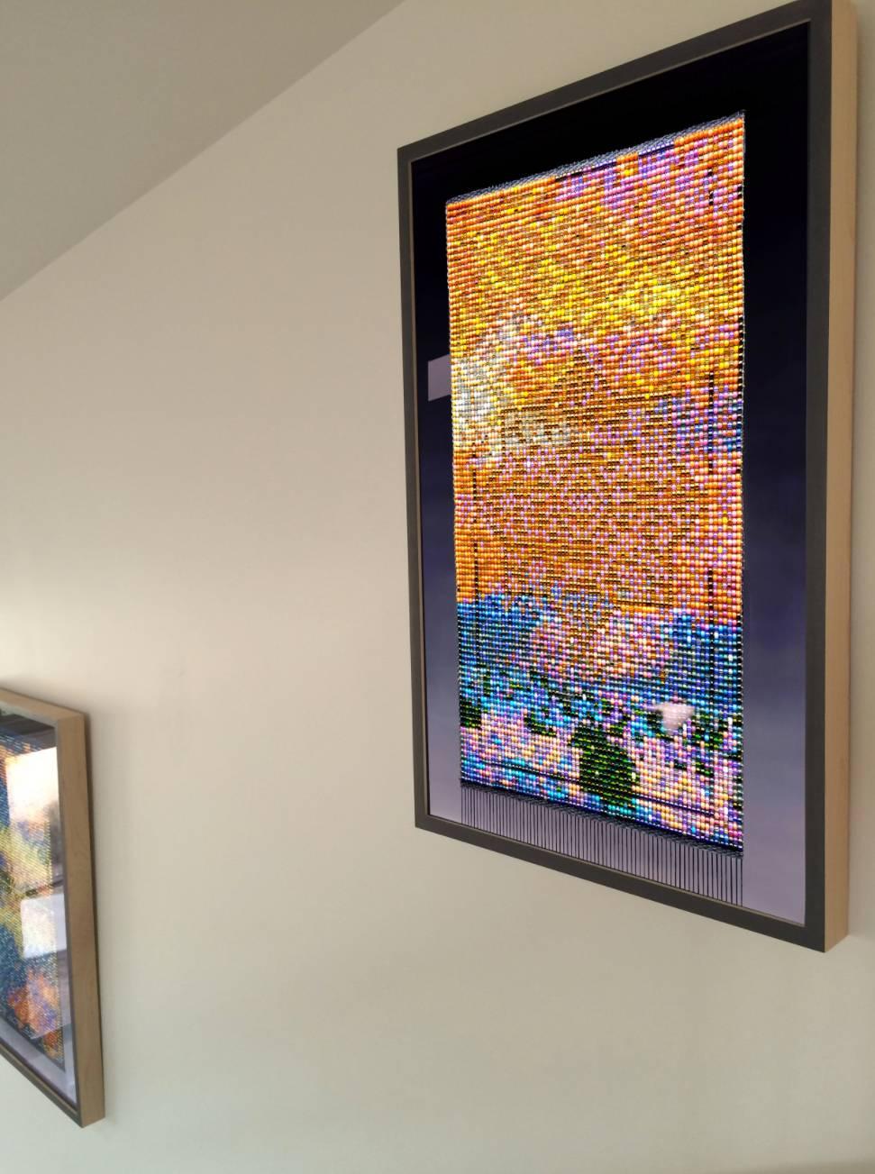 Sari Davis weaves thousands of minute beads into one fabric, no larger than a
human hand. Playing with scale and perception, Davis then re-imagines the
original weaving as a stained glass window: lit from within and glowing with
color. In each