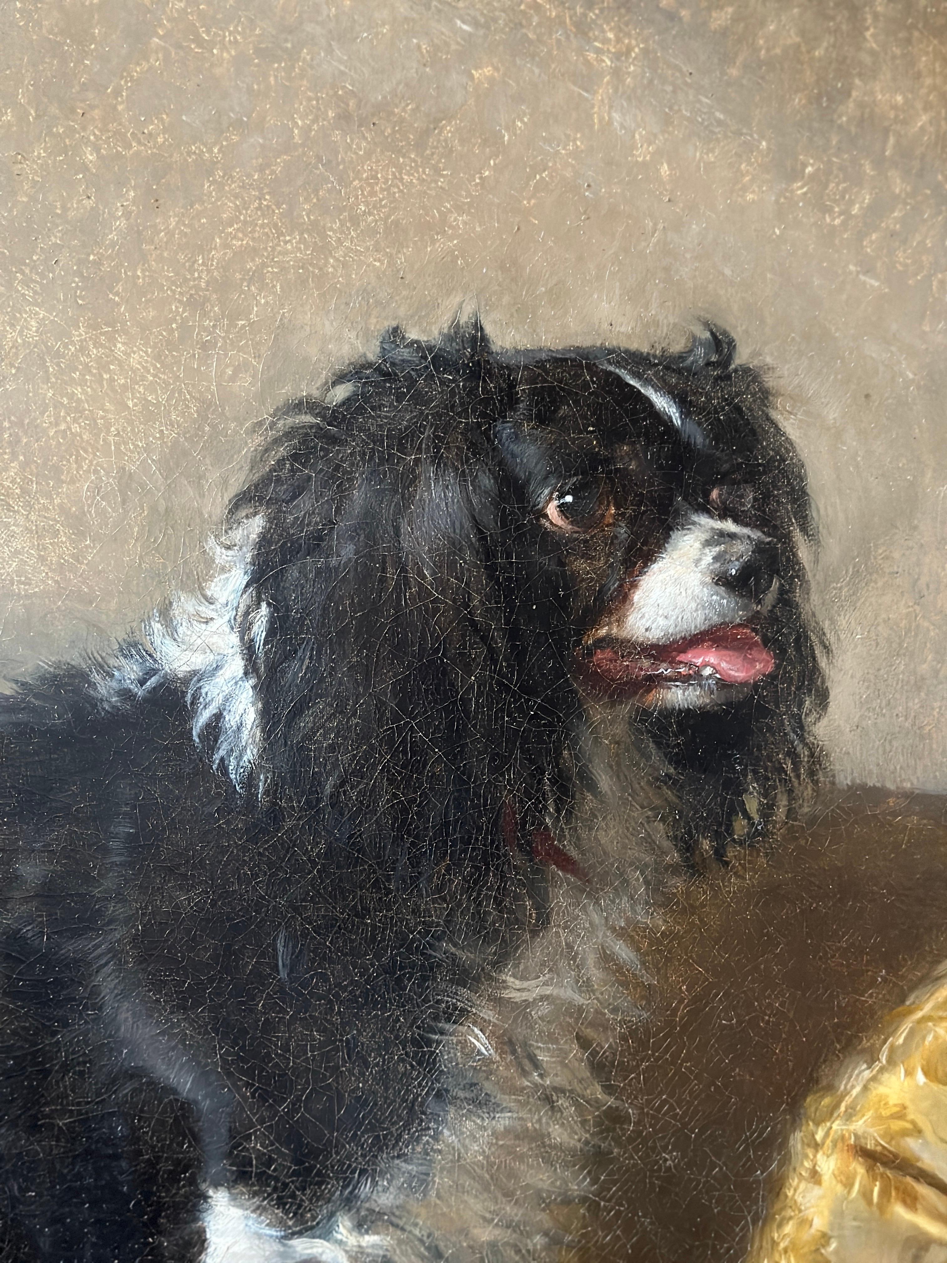 A black and white spaniel standing on a yellow silk damask covered day-bed in a sumptuous interior. 

Provenance:
With Arthur Ackermann & Son Ltd., London.
Anonymous sale; Christie's, South Kensington, 15 May 2007, lot 284
Private collection,