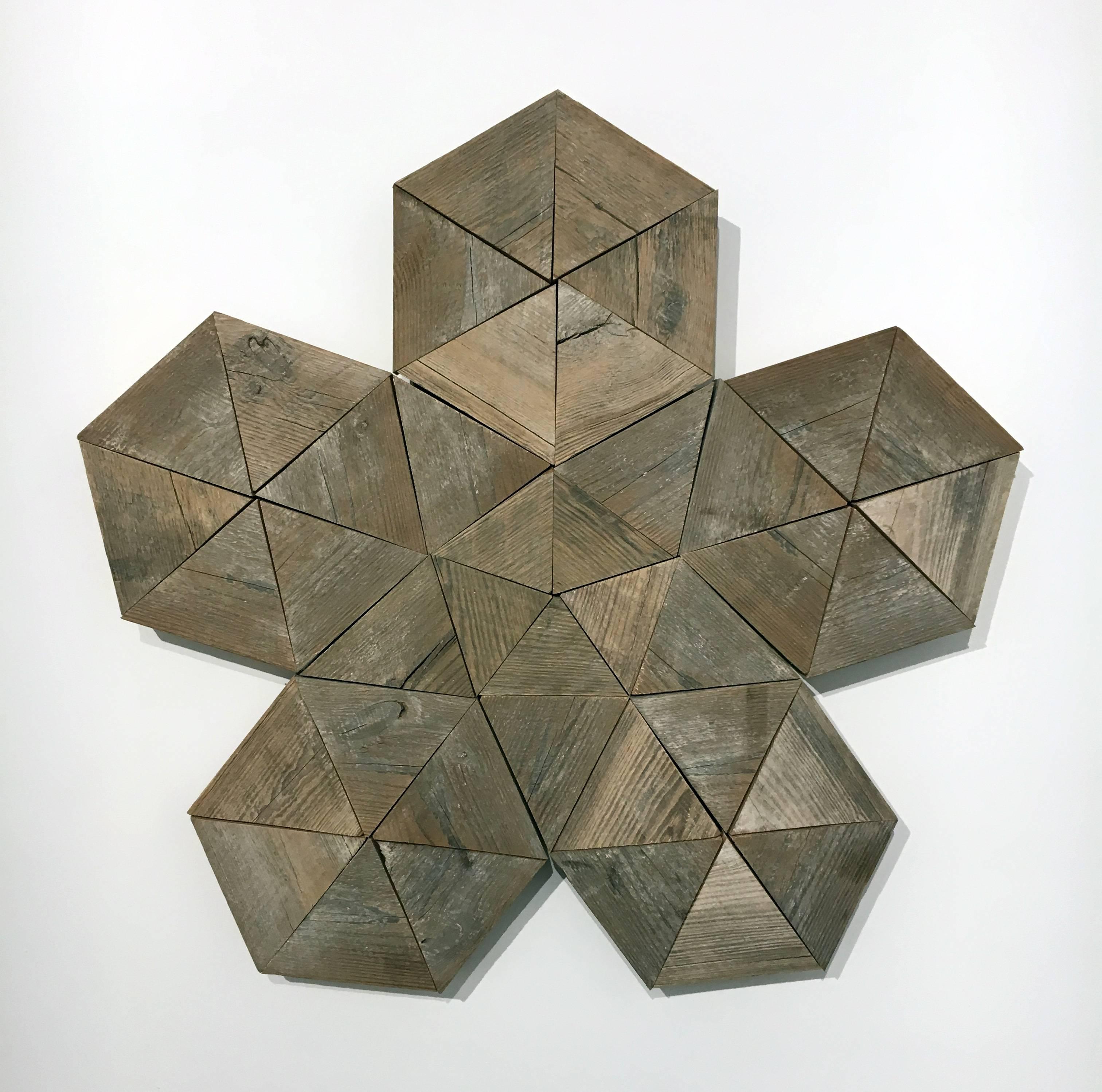 Utilizing reclaimed materials, Lowder employs his in depth knowledge of geometry to create pleasing and harmonious sculptures. 

Wall hanging sculpture, 42 inches tall by 42 inches wide

wood, geometry, wall sculpture, natural, earth tones