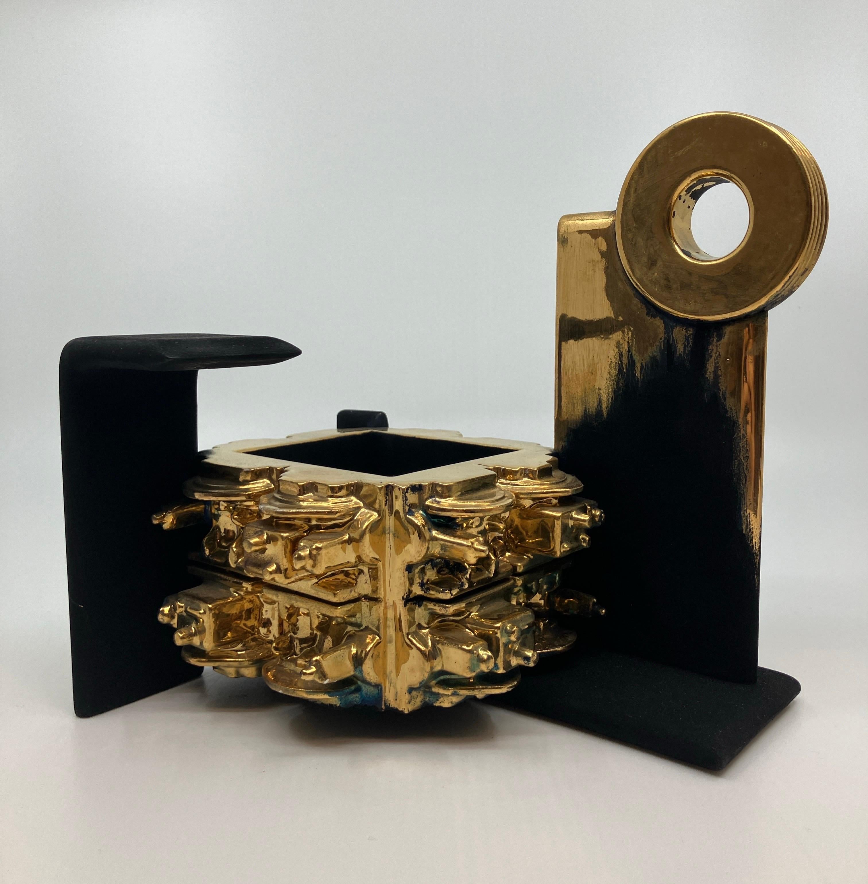 Contemporary, Ceramic, Sculpture, Gold Luster, Glaze, Crucible with Flywheel

Born in Detroit, Steven Montgomery’s work revels in a history of industry and aging as the artist uses porcelain to produce intricate mechanical forms with the appearance