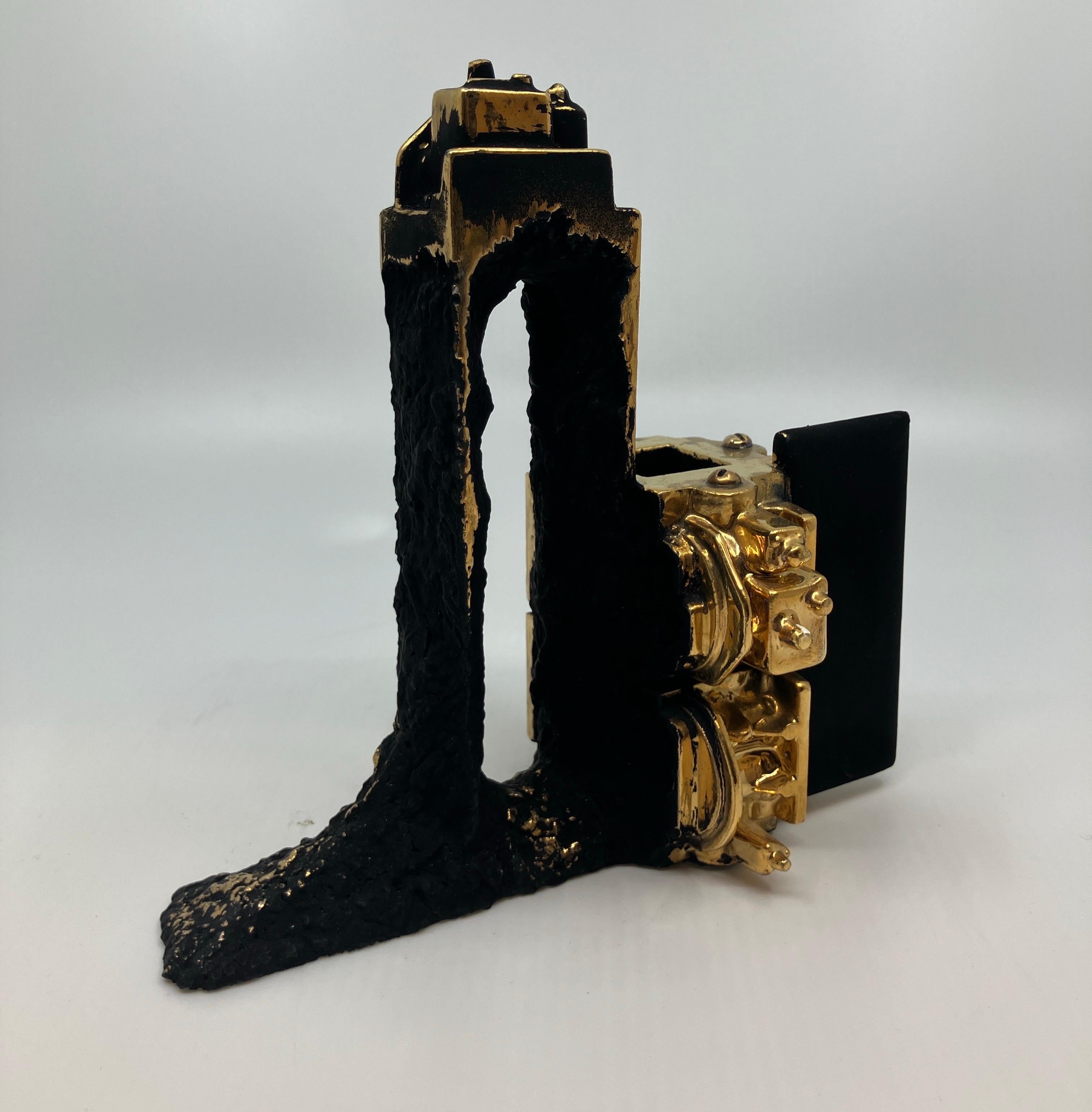 Contemporary, Ceramic, Sculpture, Gold Luster, Glaze, Crucible with Portal

Born in Detroit, Steven Montgomery’s work revels in a history of industry and aging as the artist uses porcelain to produce intricate mechanical forms with the appearance of