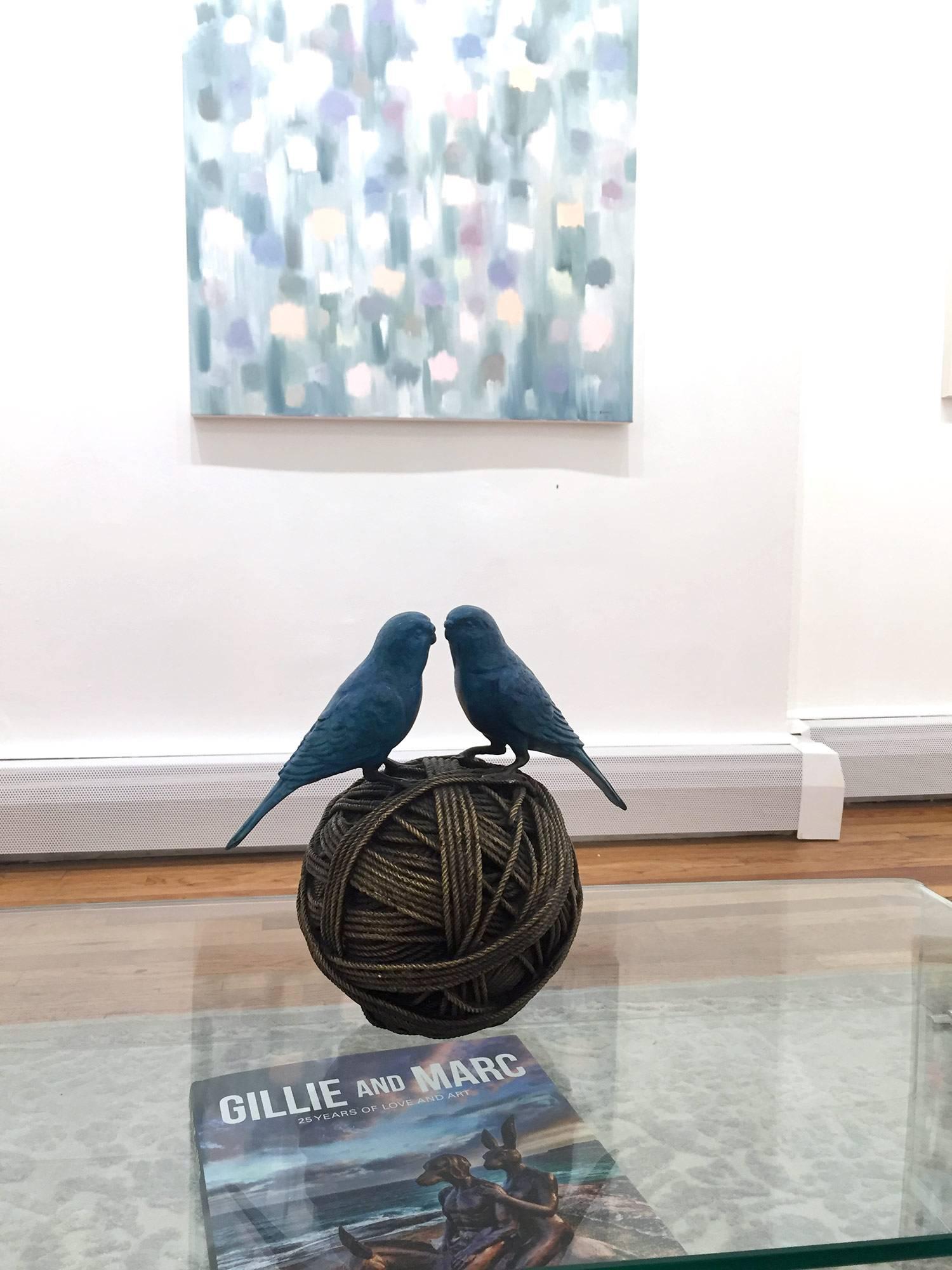 A wonderful yet very playful piece depicting 2 budgies on a ball of rope from Gillie and Marc's collection of artistic icons, which has picked up much esteem across the globe. Here we find this very balanced piece as the birds are facing each other