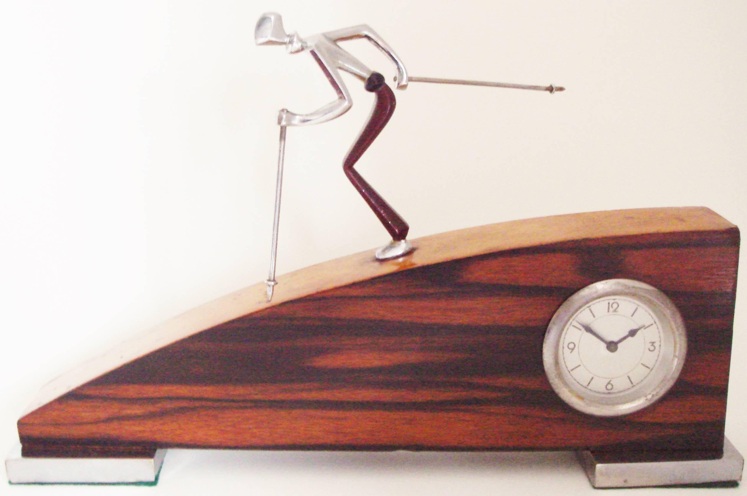 This rare and stunning Italian Art Deco or Futurist clock also contains elements of the Style Littorio design of Italy of the 1930s. The wooden body of the clock stands on two square plinths that are each clad in a chrome sheet that both retain