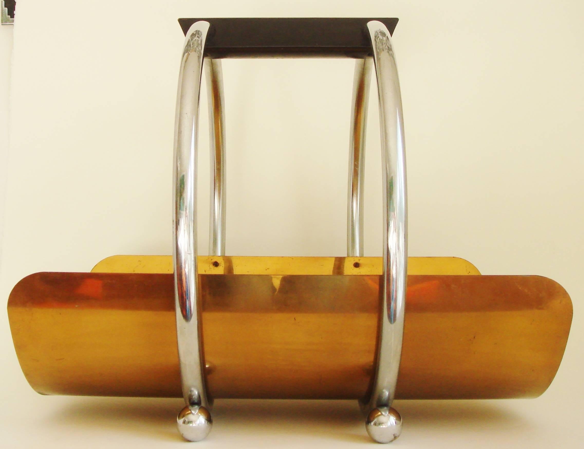 This Iconic American Art Deco log holder/magazine rack was designed by Leslie Beaton for the Revere Brass and Copper Company of Rome, New York. It first appeared in the Revere Gifts catalogue for 1937 where it was named the 