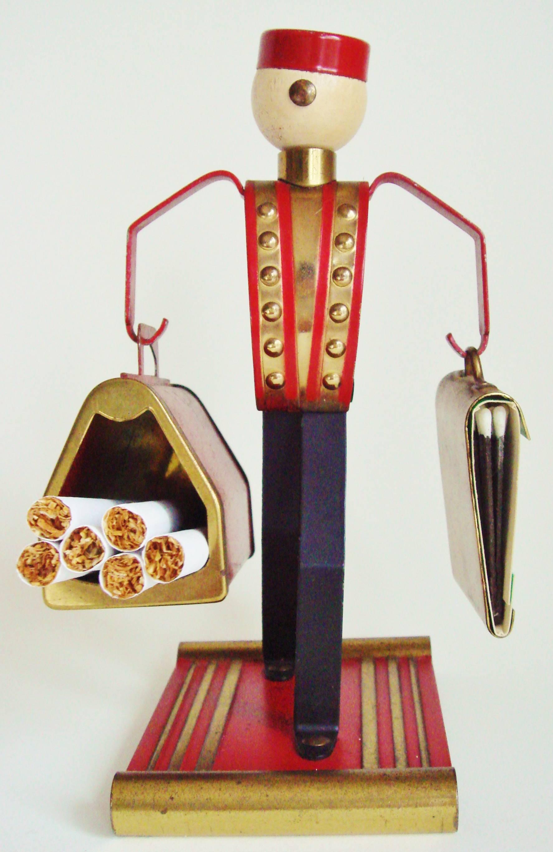 This delightful pair of American Bellhop table accessories were produced to cash-in on an incredibly successful Philip Morris cigarette advertising Campaign. The Campaign, launched in 1933, featured Johnny Roventini, the traditionally garbed bellhop