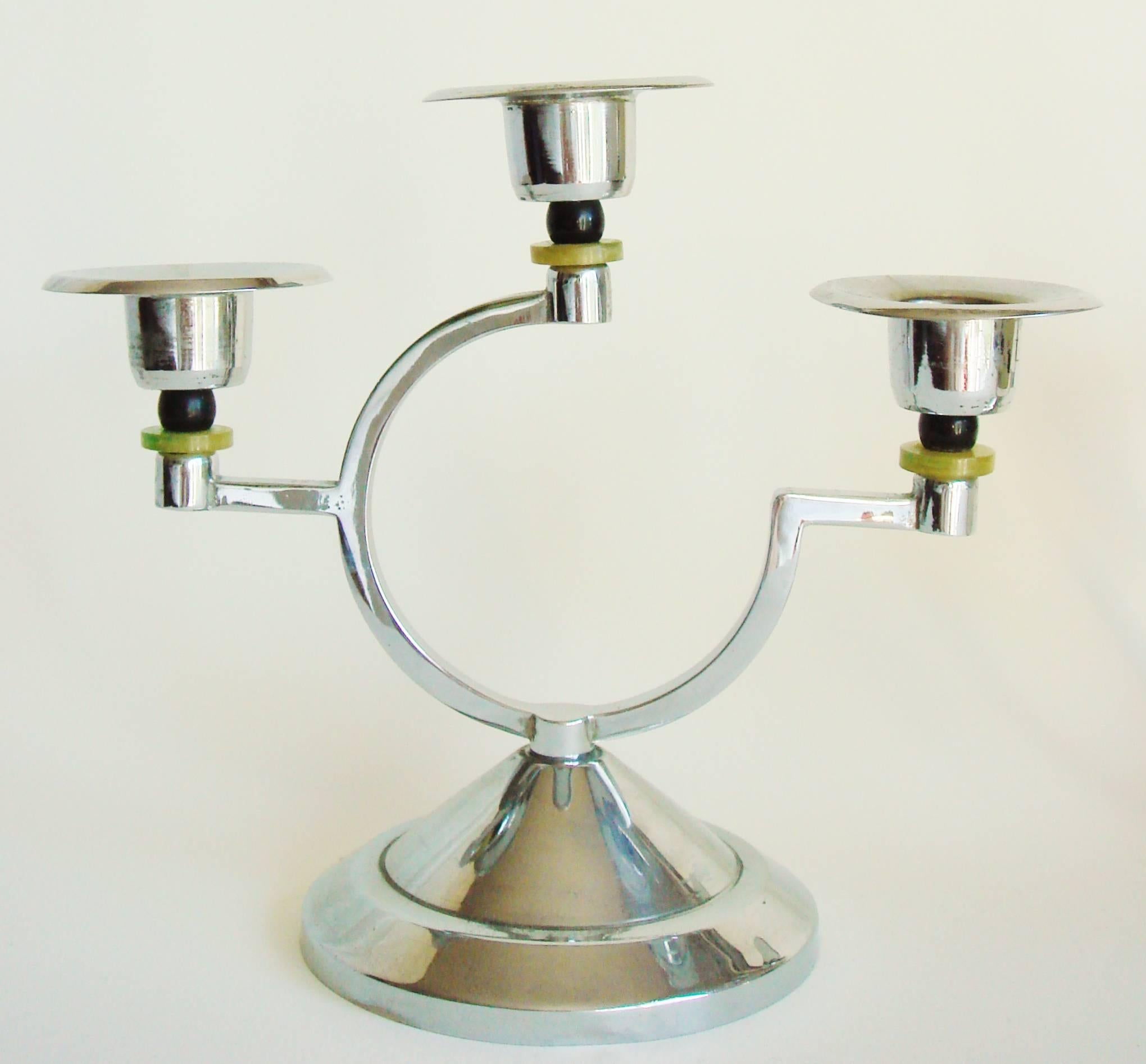 This stylish pair of English Art Deco chrome-plated asymmetrical triple candleholders feature black and green marbled Bakelite accents supporting each socket. The Bakelite is bright and shiny and the original chrome plating is in excellent condition