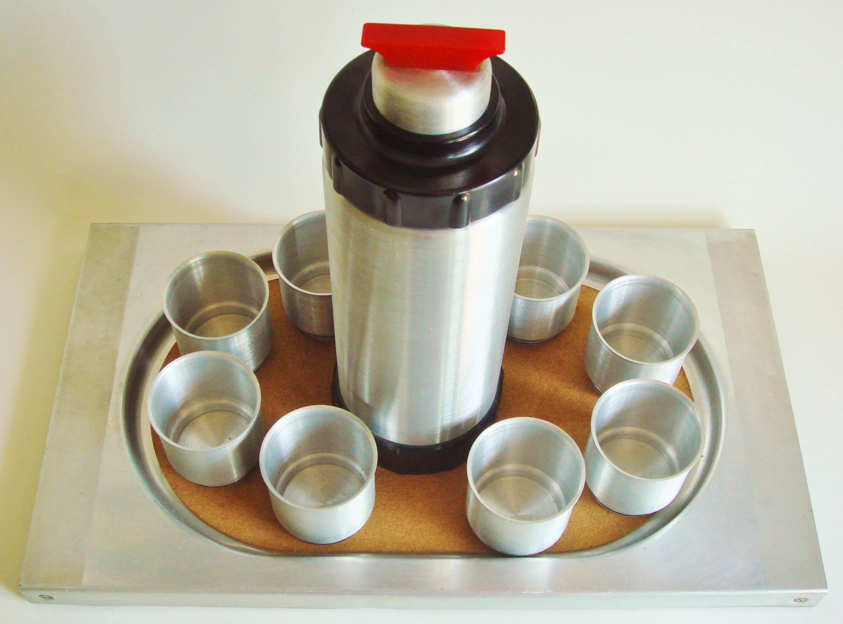 This rare and iconic American ten-piece cocktail shaker set was designed for the West Bend Company of Wisconsin by Ralph N. Kircher in 1934 (See US Patent below) and was marketed under the name of the 