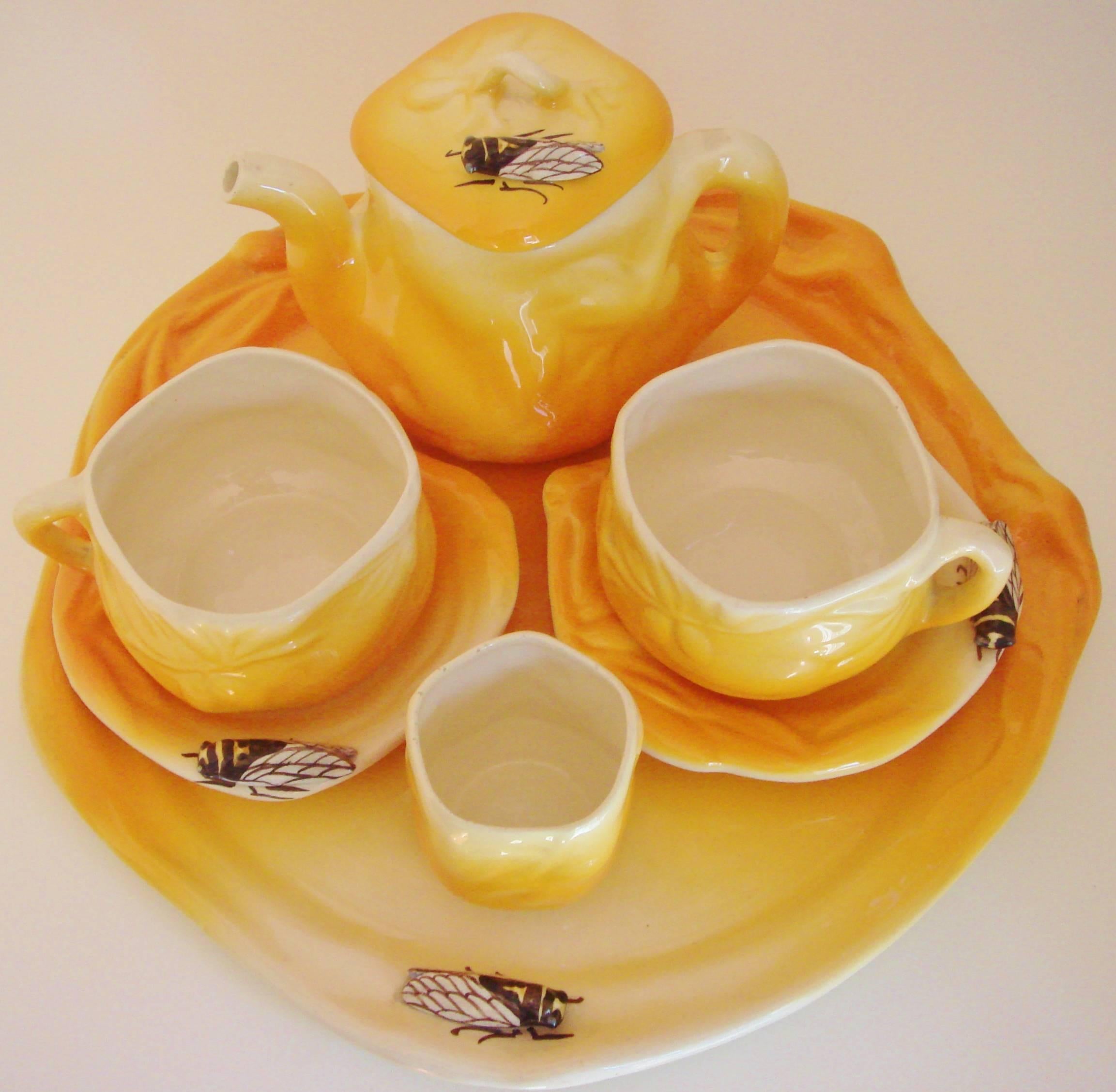 This fabulous Provençal French Mid-Century five-piece faience cafe-au-lait set is by master ceramicist, Louis Sicard of Vallaurice. All of the pieces feature a relief pattern of olive laden branches and are glazed in the brilliant yellow or orange