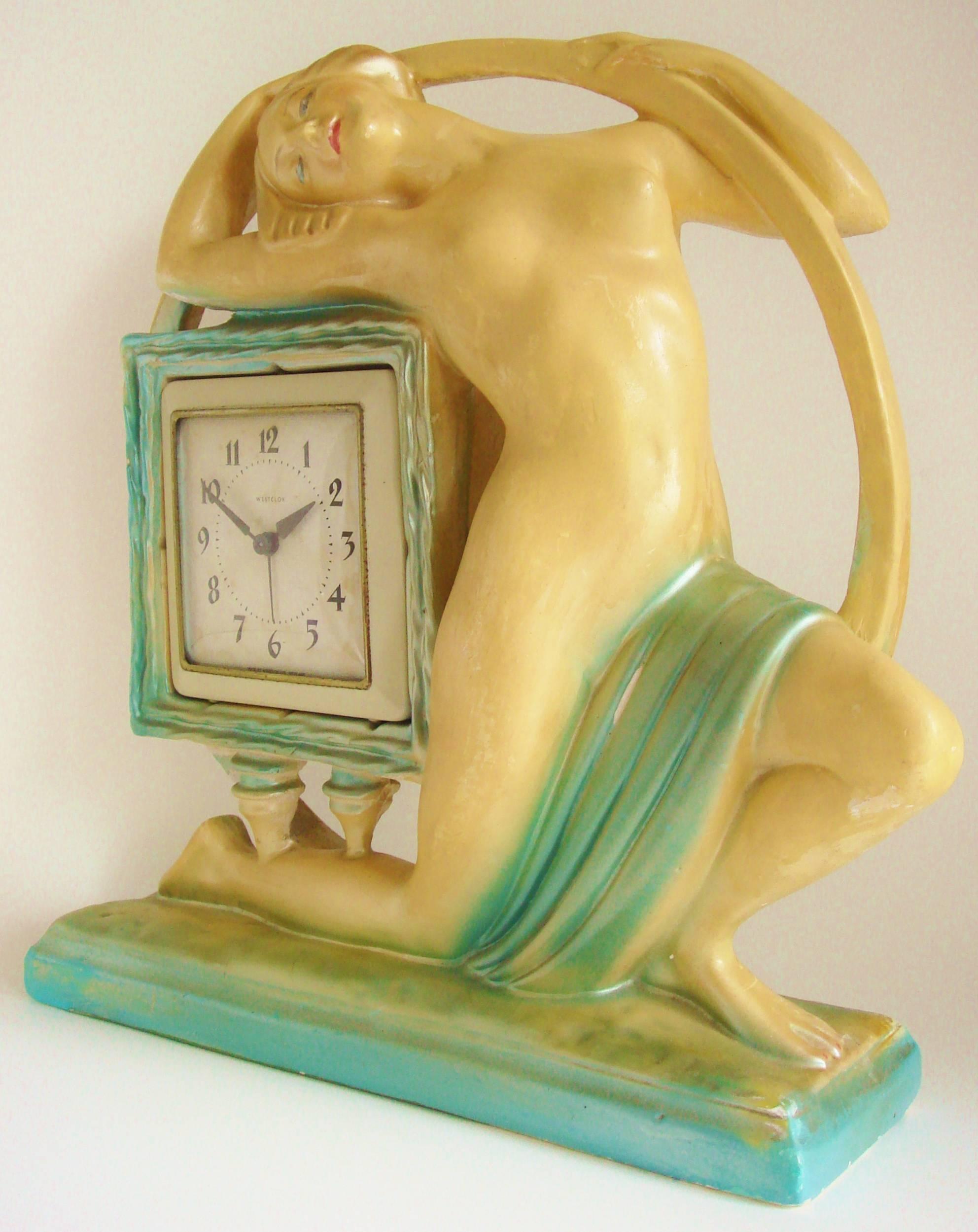 The housing for this rare, huge and magnificent English Art Deco mantel clock was created by the studios of the Ornamental Plaster Company (The O.P. model number is just discernible under the paint at the rear of the base of the circle) and was