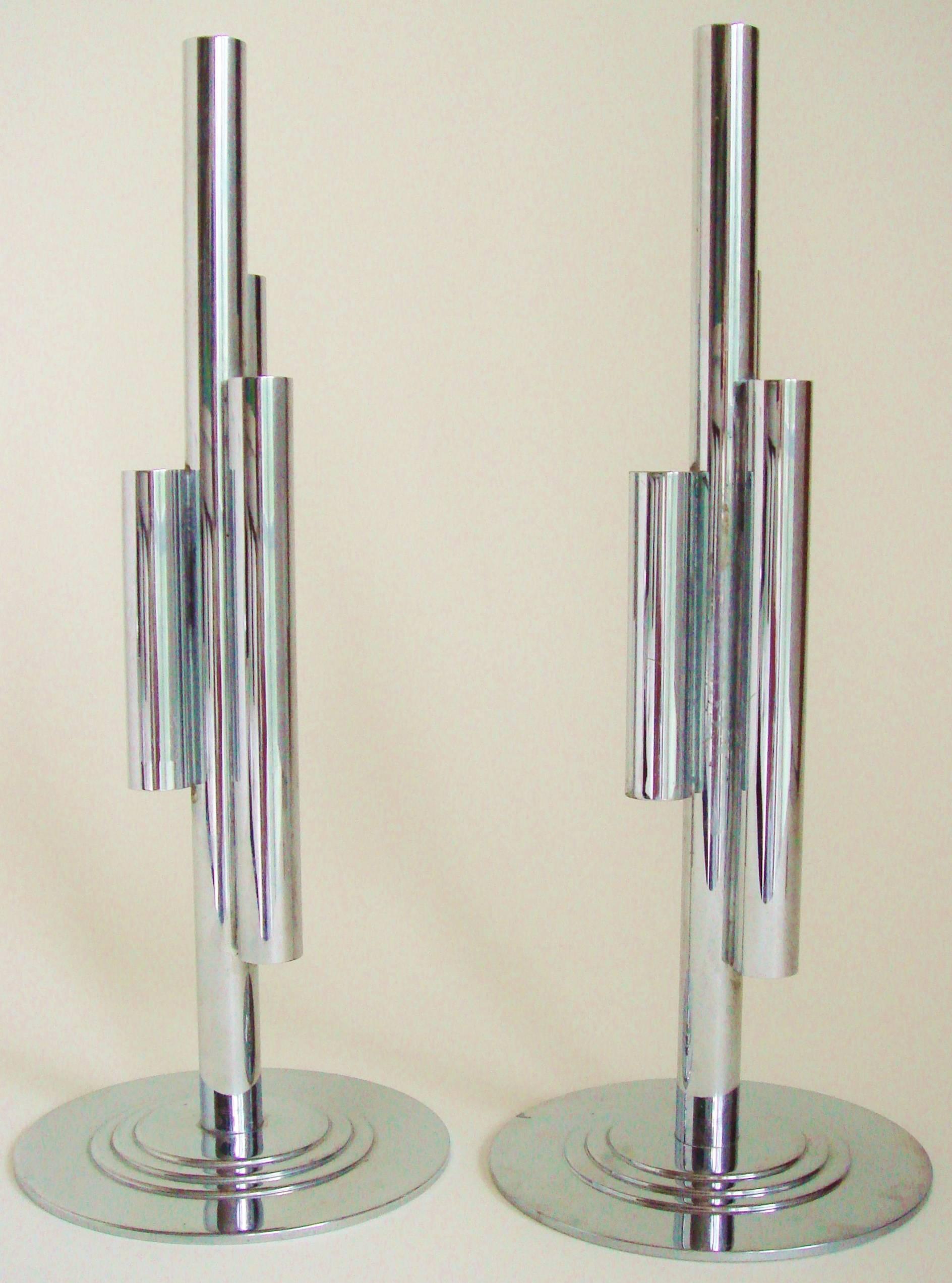 This pair of American Art Deco four-tube budholders were designed by Ruth and William Gerth for the Chase Brass and Copper Company Inc. of Waterbury, Connecticut. The design features a central chrome tube attached to which are three tubes of varying