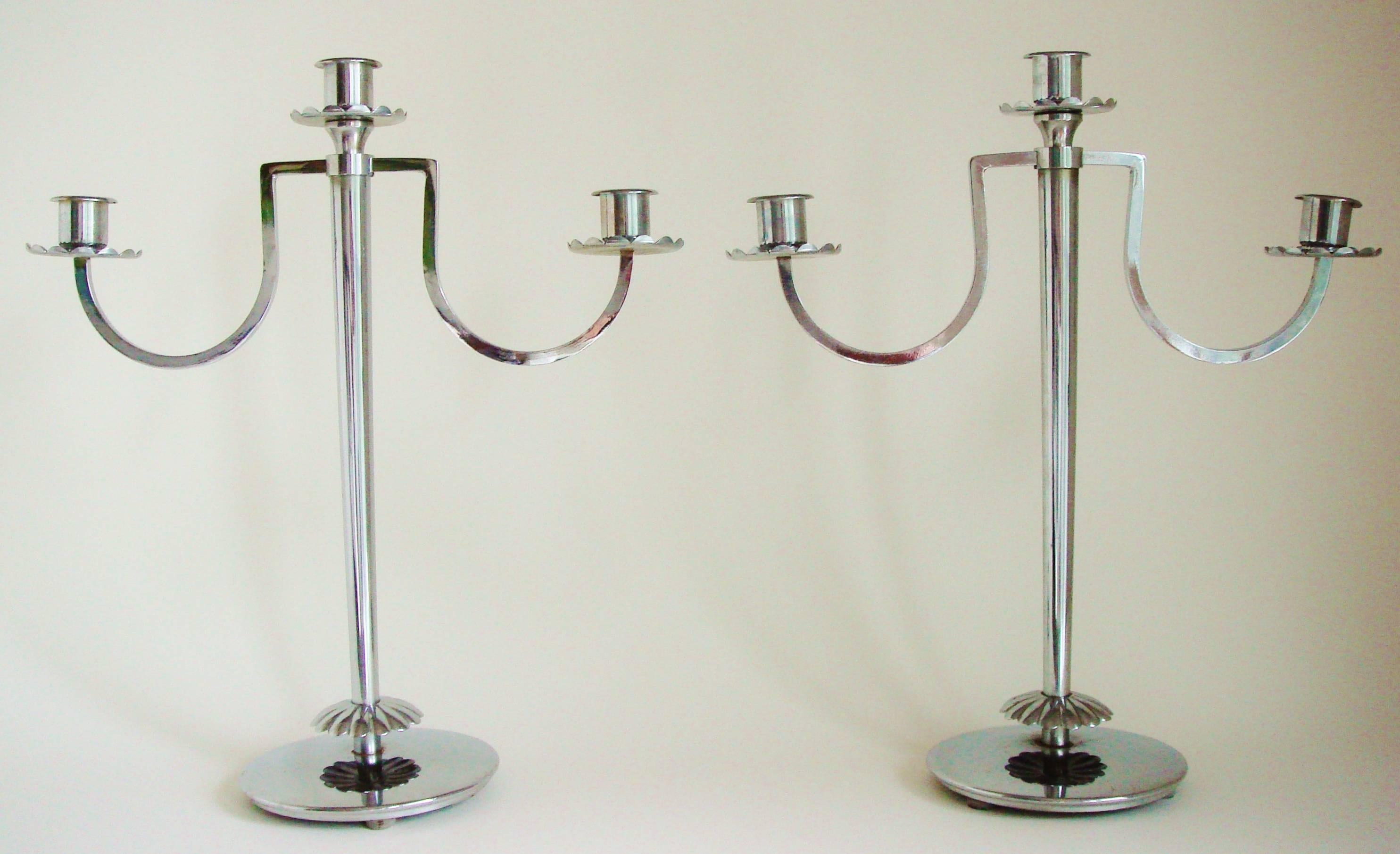 This beautiful pair of American Art Deco polished chrome Diana triple candleholders were designed by Harry Laylon for the Chase Brass and Copper Company Inc. of Waterbury, Connecticut. They were featured in the Chase Specialties catalogues from 1936