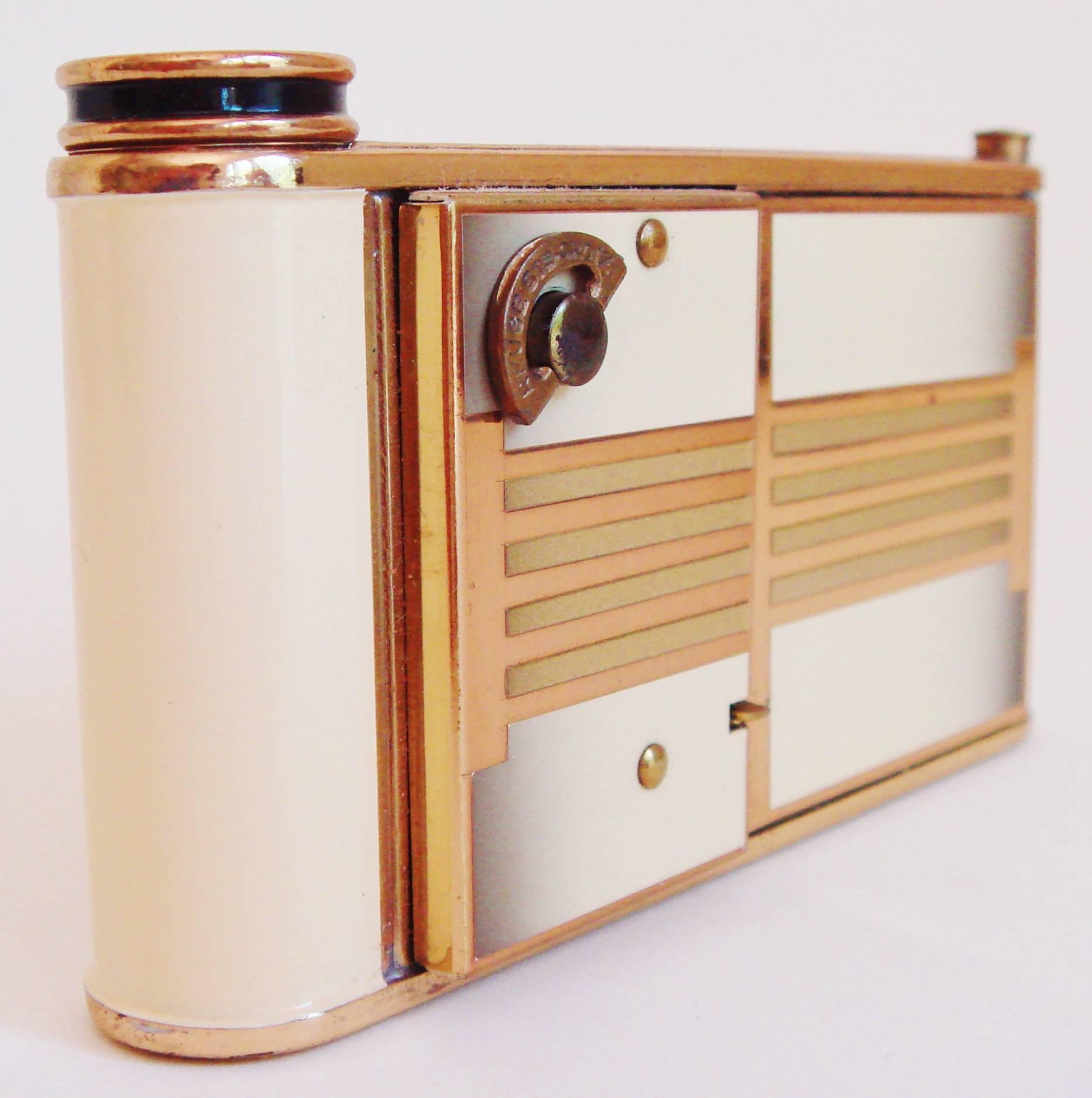 This ingenious style of German Art Deco musical combination compact and cigarette case was known as a Camera or Kamra Compact. Versions of these were produced with sewing kits instead of cigarettes, integral watches and even with an actual camera.