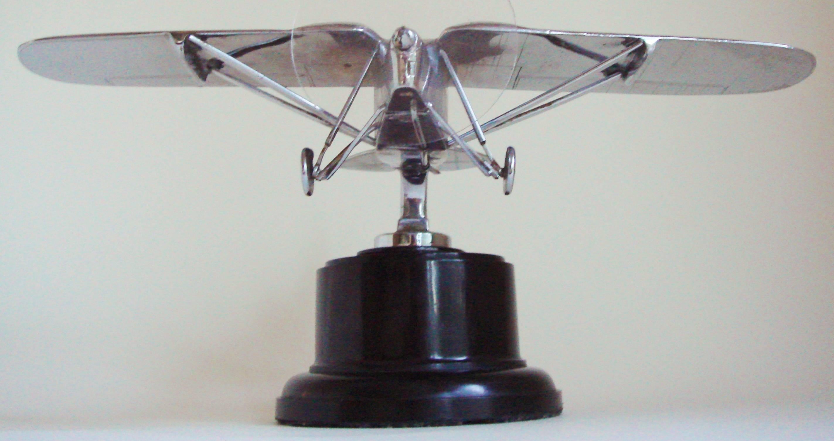 This large English Art Deco chrome-plated De Havilland Puss Moth car mascot/hood ornament would appear to be the work of R.A. Allen for the celebrated A.E. Lejeune company. It was he that designed the Puss Moth table lighter to commemorate the