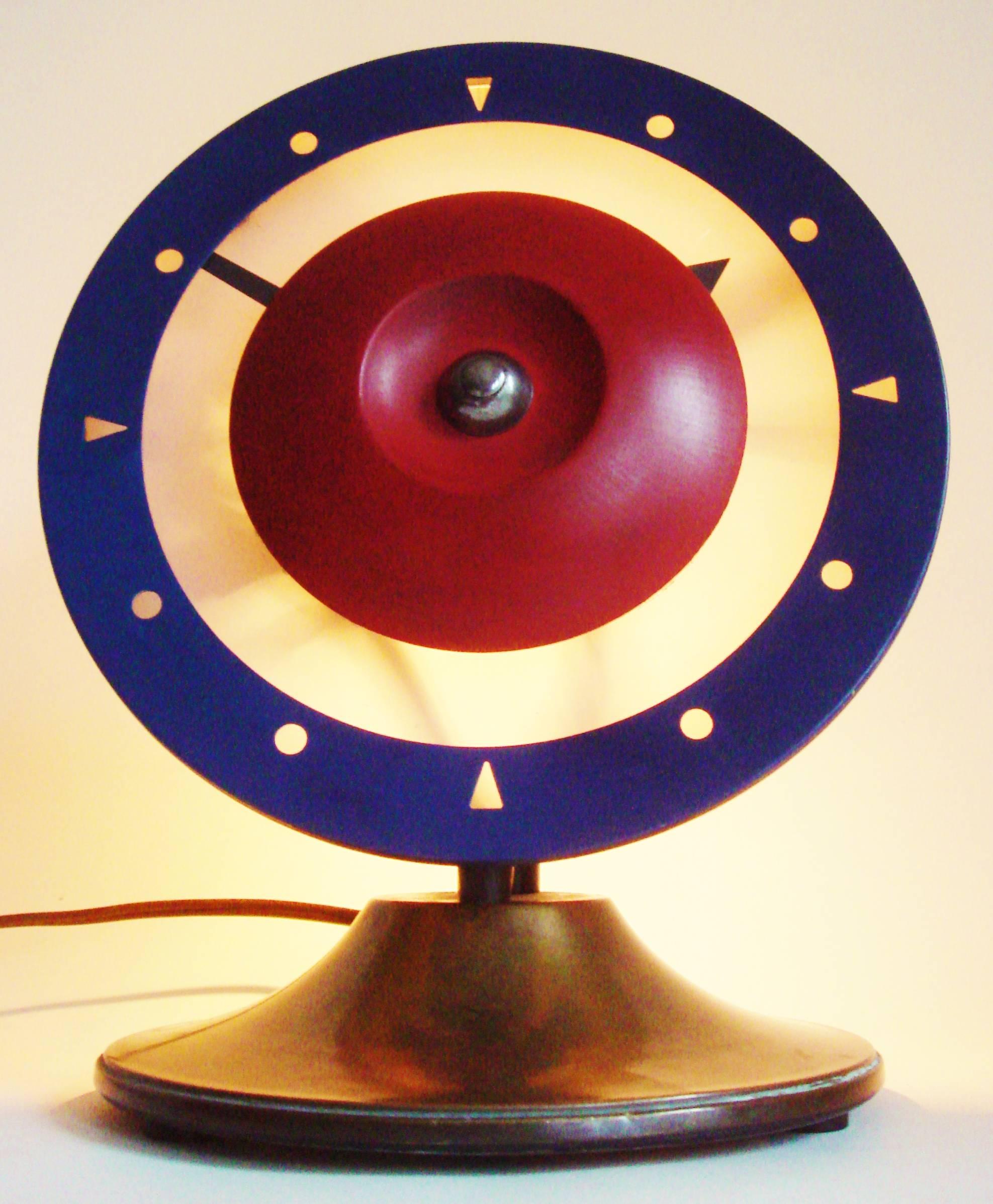 We have seen an example of this great looking Art Deco brass illuminated desk clock in England. It was described as a Royal Air Force desk clock owing to its tri-color R.A.F. roundel face but we have also heard them referred to as target clocks.