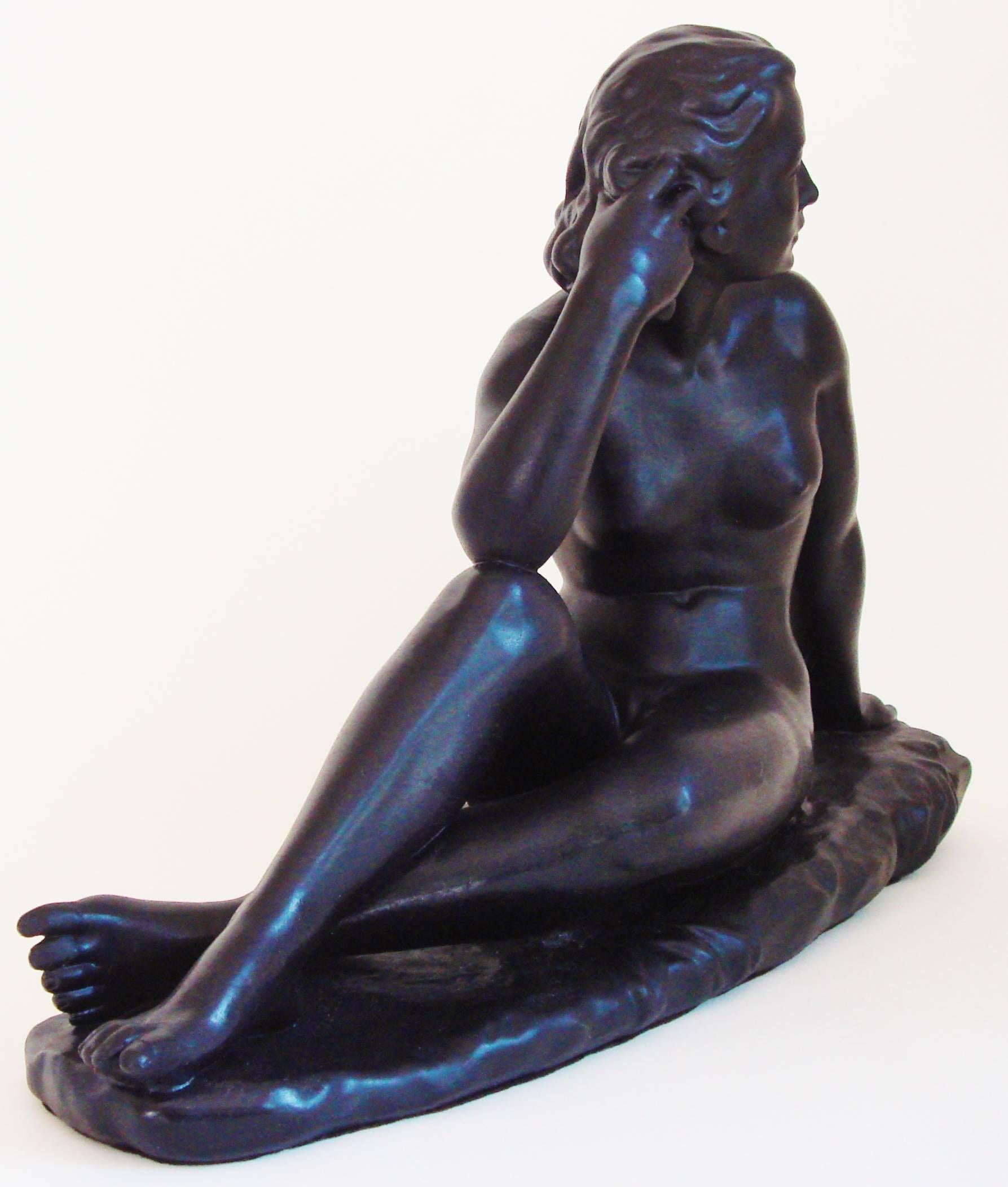 This exquisite Canadian Mid-Century female seated nude was created by Jackir Studios of Toronto in 1965. It is executed in plaster and has no chips or cracks plus all paint is original. We have included pictures taken at all angles plus close ups of