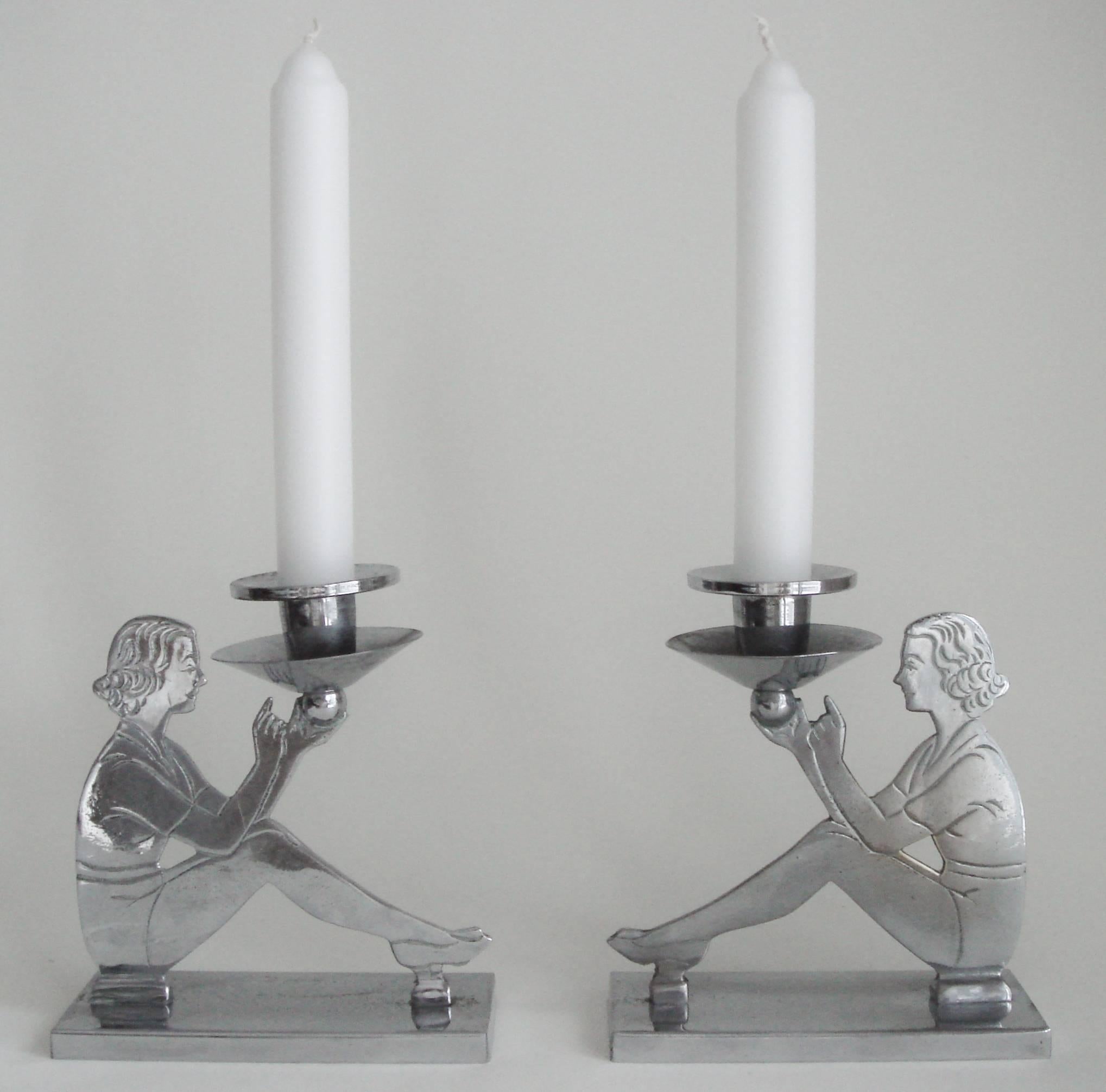 Plated Pair of English Art Deco Chrome Figurative Seated Female Candlesticks For Sale