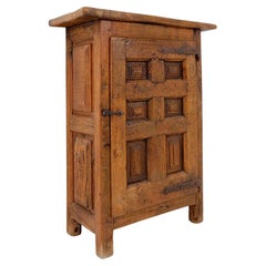 Rustic wooden cabinet with carved panel door & iron hardware - Spain, early 19th
