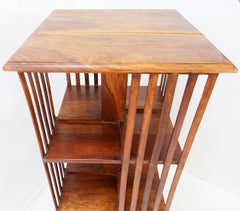 Three-tier revolving bookcase on a central cruciform base - 20th