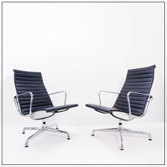 Pair of Vitra EA 116 lounge chairs by Charles & Ray Eames