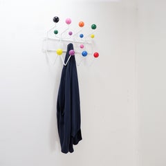 Wall-mounted coat rack with colorful balls and metal frame, "Hang It All" Style