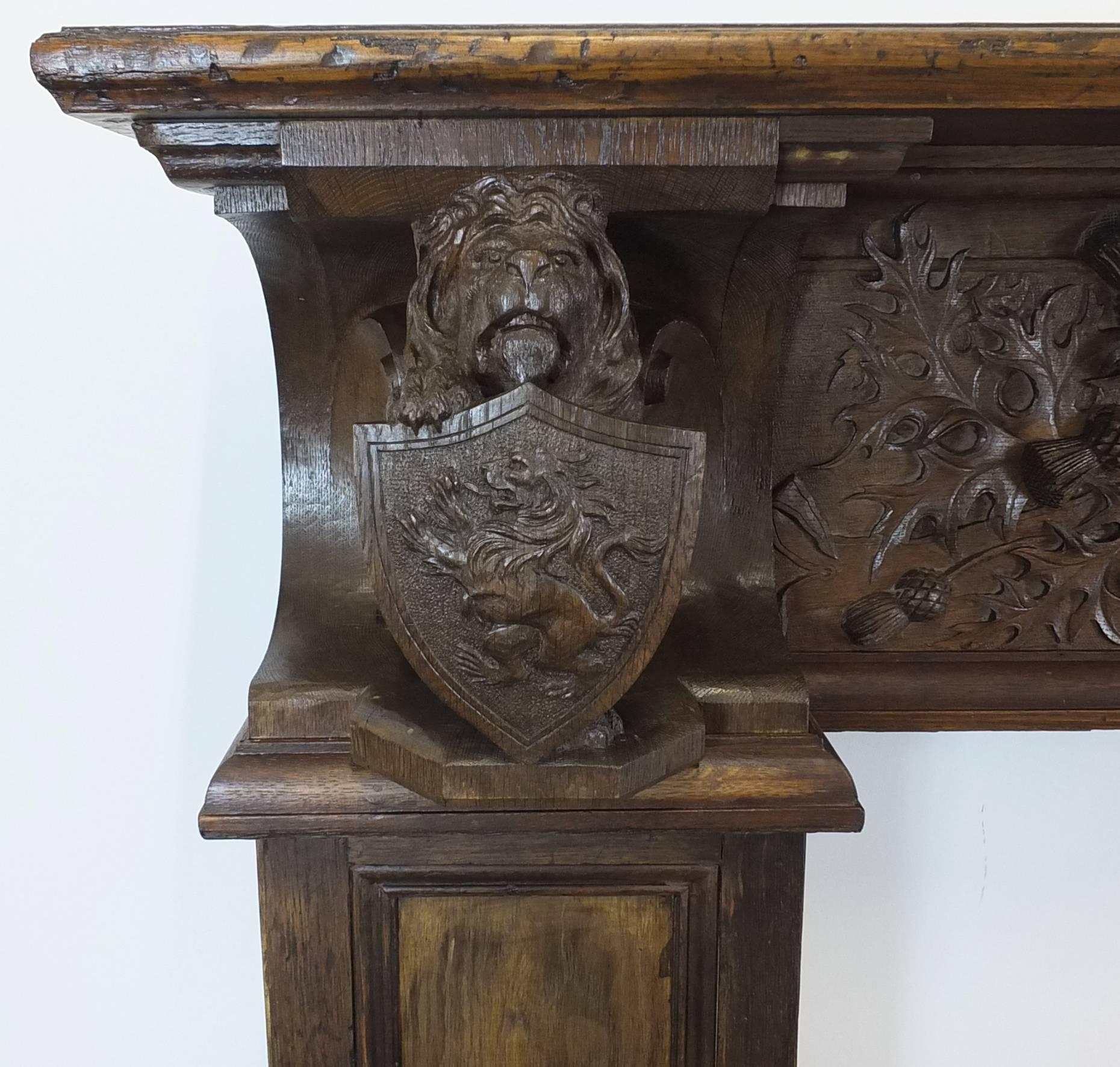 A large and historically important Scottish oak fireplace mantel. 

The main frieze panel is carved of a single piece of oak, rather than applied decoration, with elaborate thistle and foliage design and the Scottish motto ‘Nemo me impune