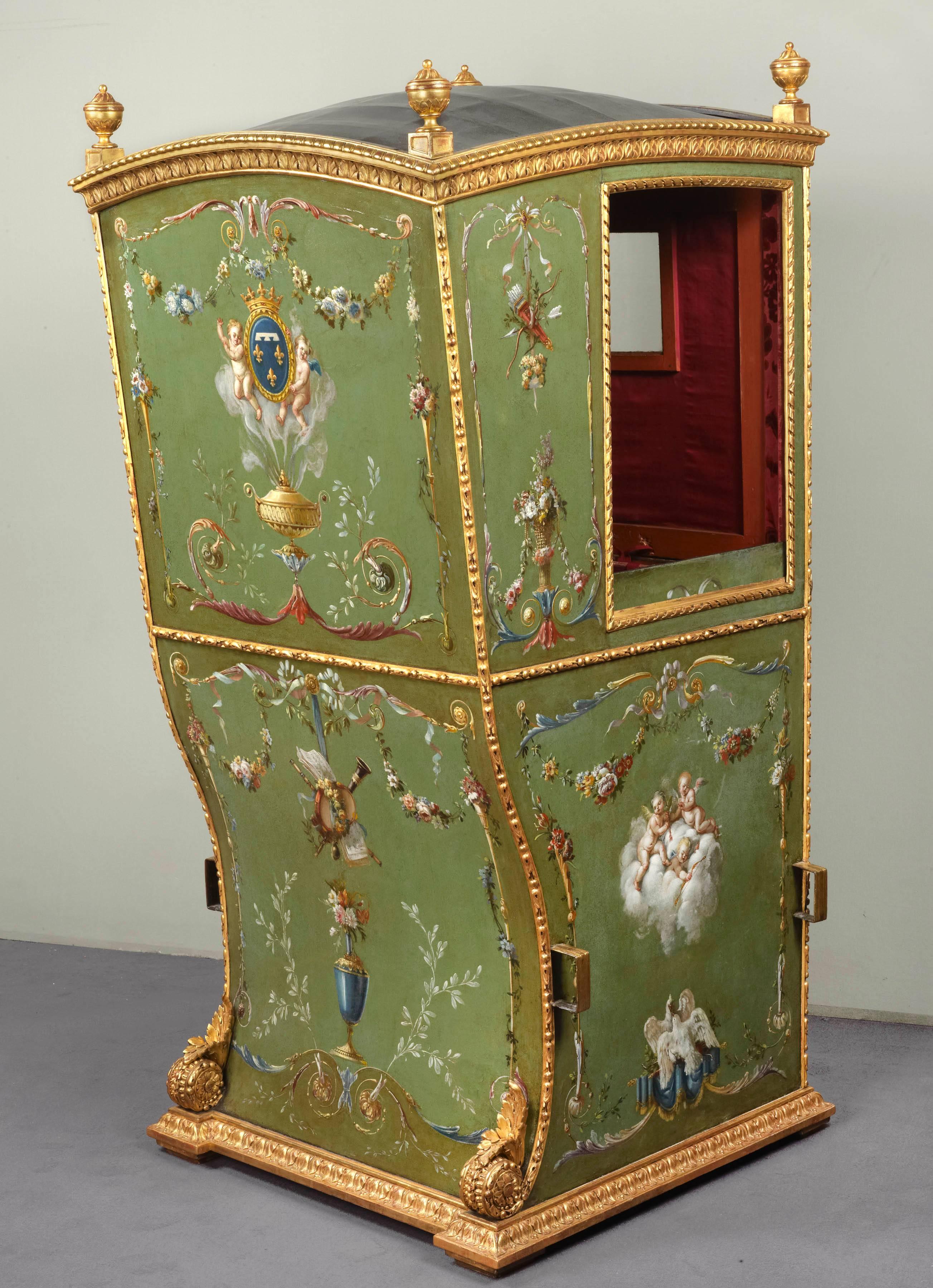 A Louis XVI leather and giltwood Sedan chair; the domed gadrooned moulded cornice is surmounted by turned finials, above there is a stiff-leaf carved frieze, the uprights are carved with berried-husks, the panelled sides with ribbon, on a berried