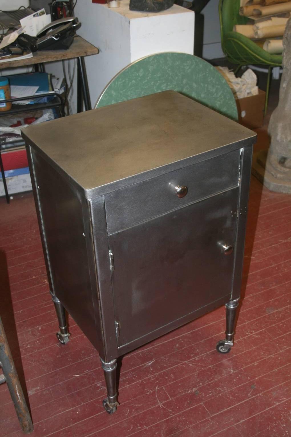 Great 1930s steel Industrial cabinet or nightstand. Made by the Simmons Co. These pieces were always painted. They were made to look like regular wooden furniture of the period, but out of steel. They were not institutional pieces. The Simmons Co.