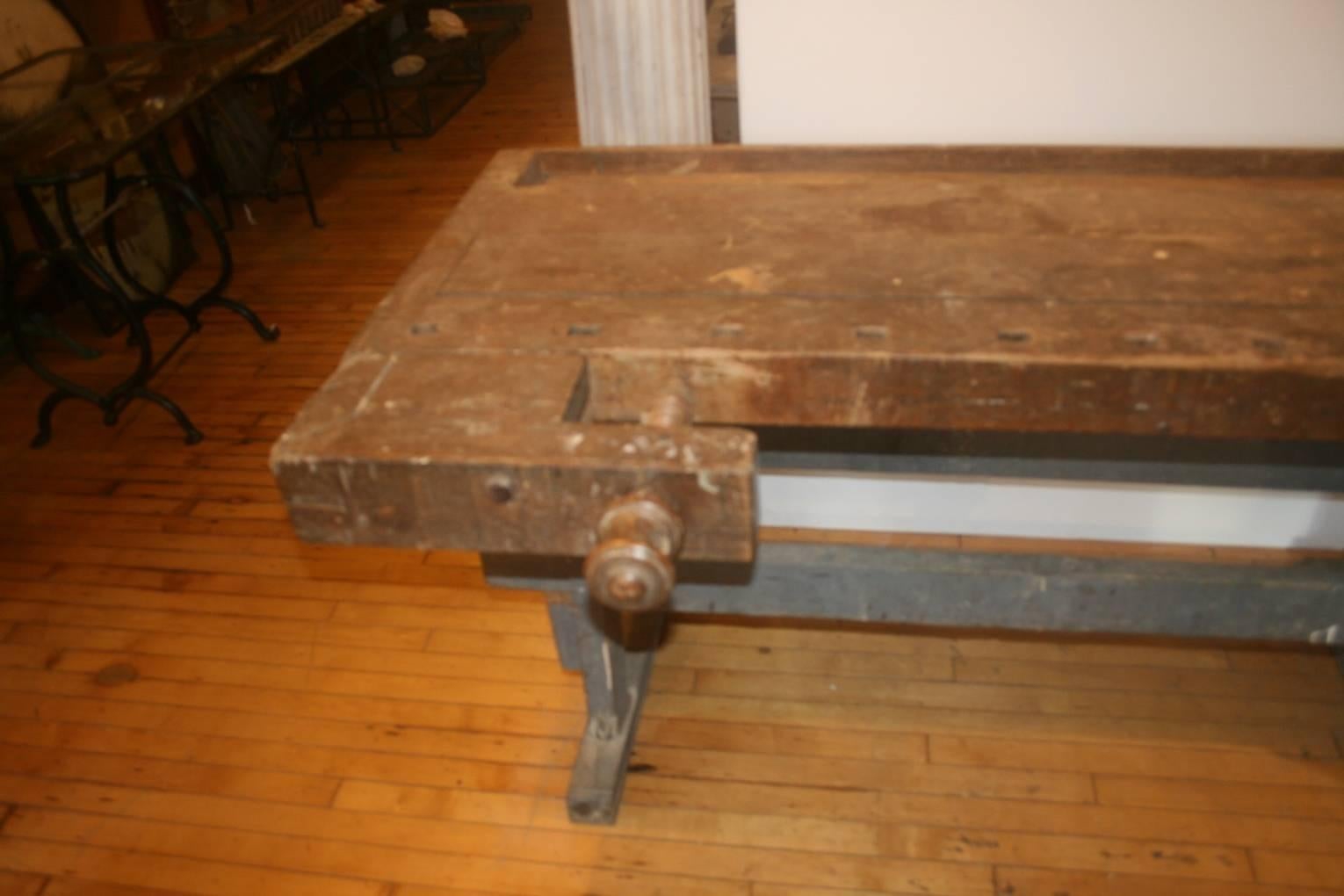 Very early carpenter's Industrial workbench, circa 1780s. Original gray paint on the base and 18th century. Characteristic wedge construction. I've seen a lot of these benches but never one this early. Probably came from an early furniture mill.