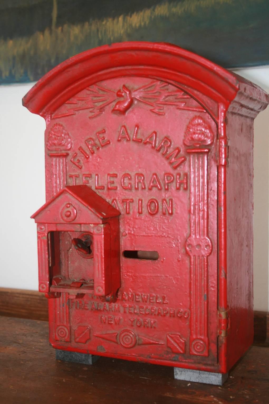 Iconic New York red painted electric fire alarm box. Great for a collector of interesting vintage New York City memorabilia it's also just simply a beautiful object. The hand hold the lightning bolts is a great image. This particular fire alarm box