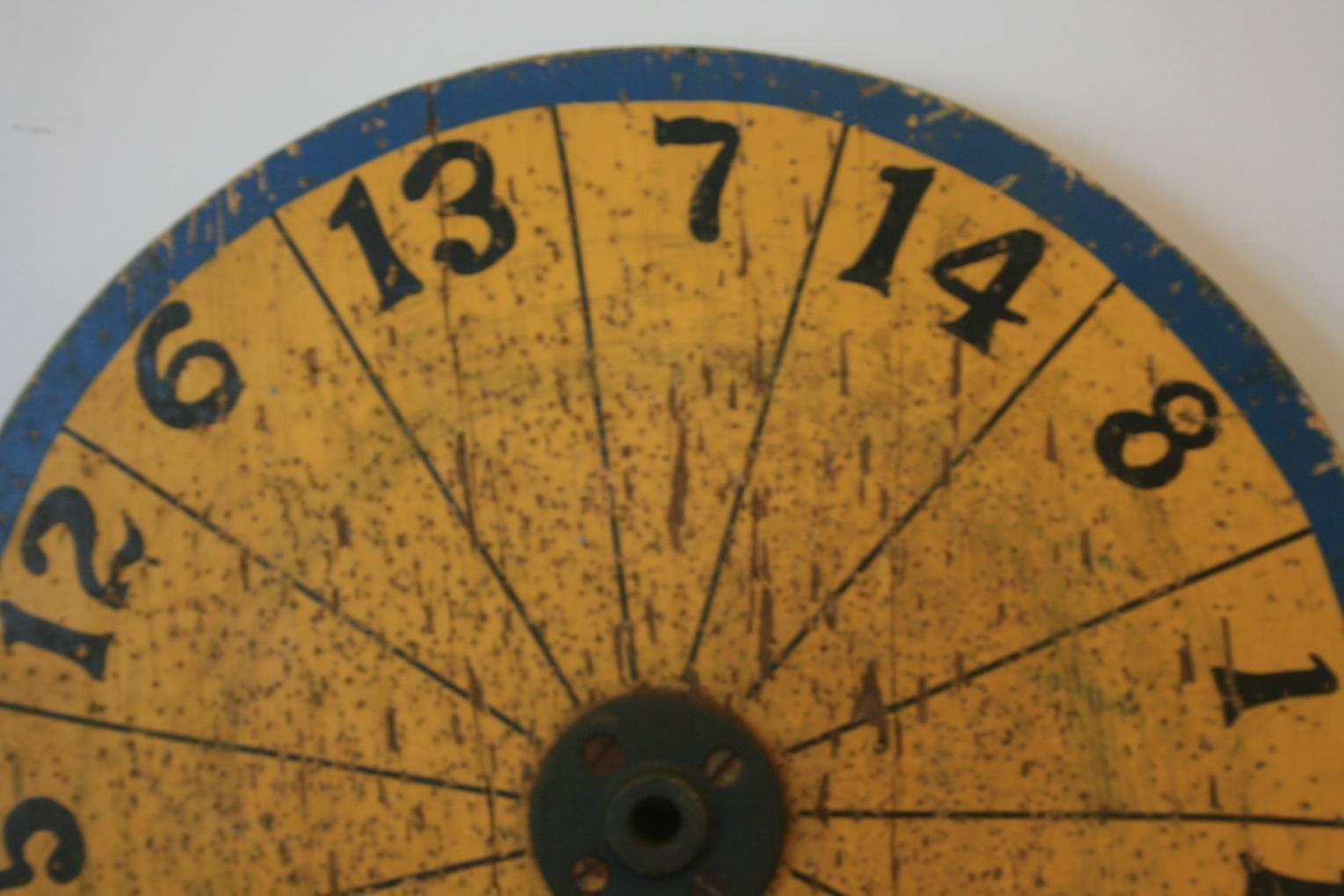 Great yellow and blue dart board, circa 1900. Great unusual colors on this Folk Art dart board. Measures: 18 inch diameter and about 1 1/2 inches thick. A beautiful piece of Americana. It has seen a lot of use over the years which adds to its