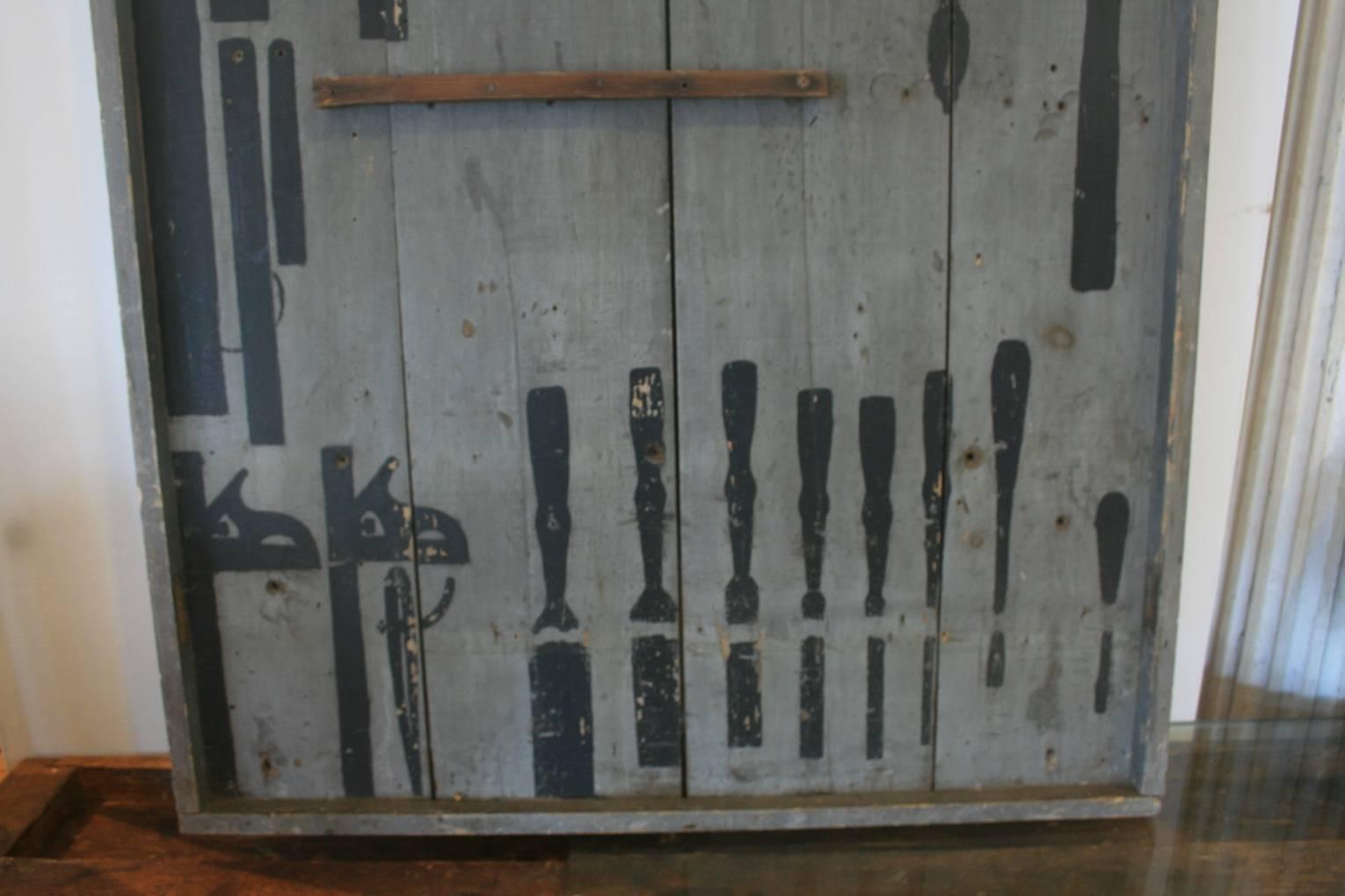 Industrial /Folk Art tool organizer panel. Tool silhouette in black paint against gray background makes a kind of found art wall sculpture. All original paint. This one was probably made, circa 1930.