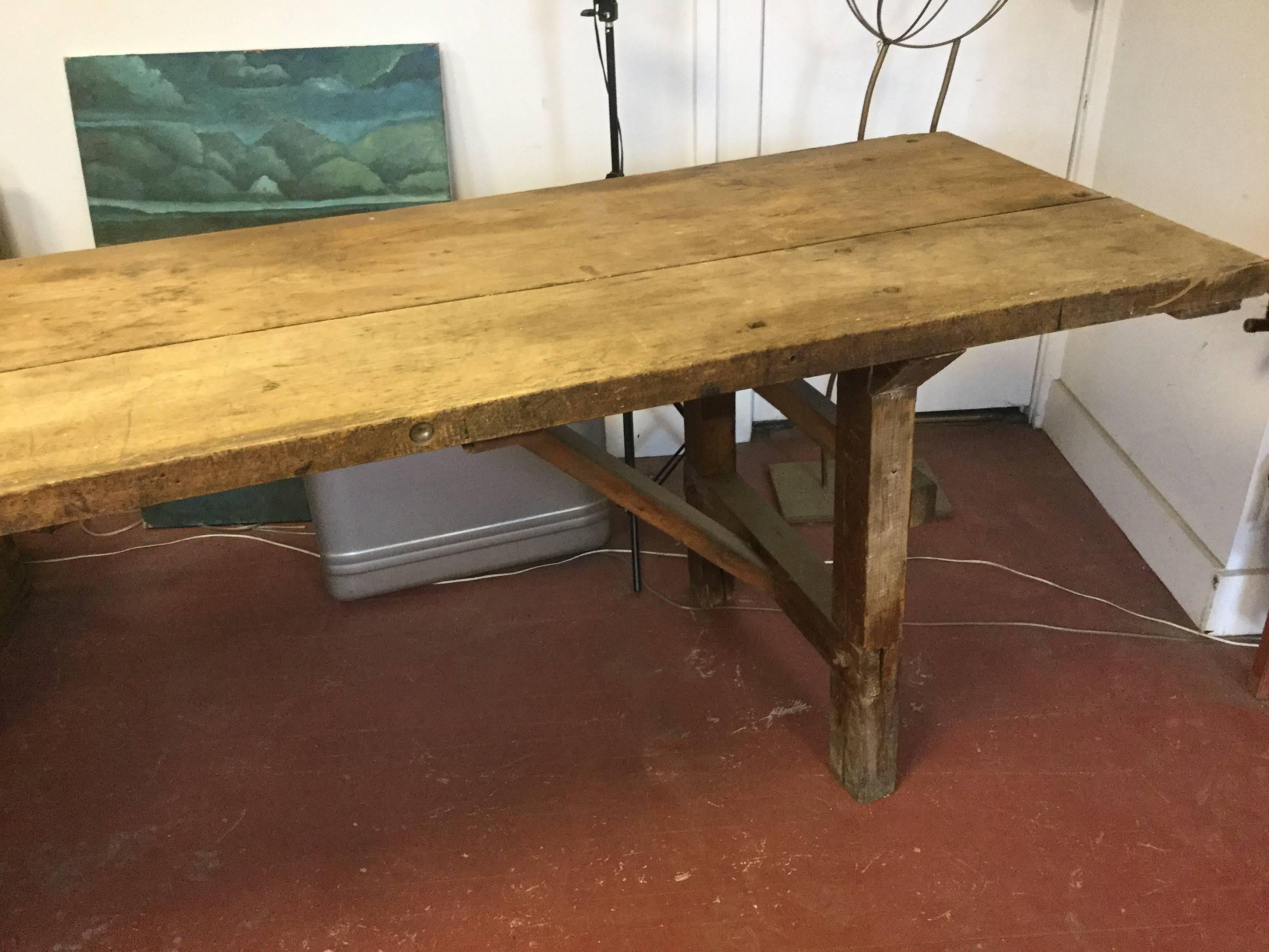 19th century industrial carpenters table. Beautiful patina on solid walnut top. Good looking cross braces.