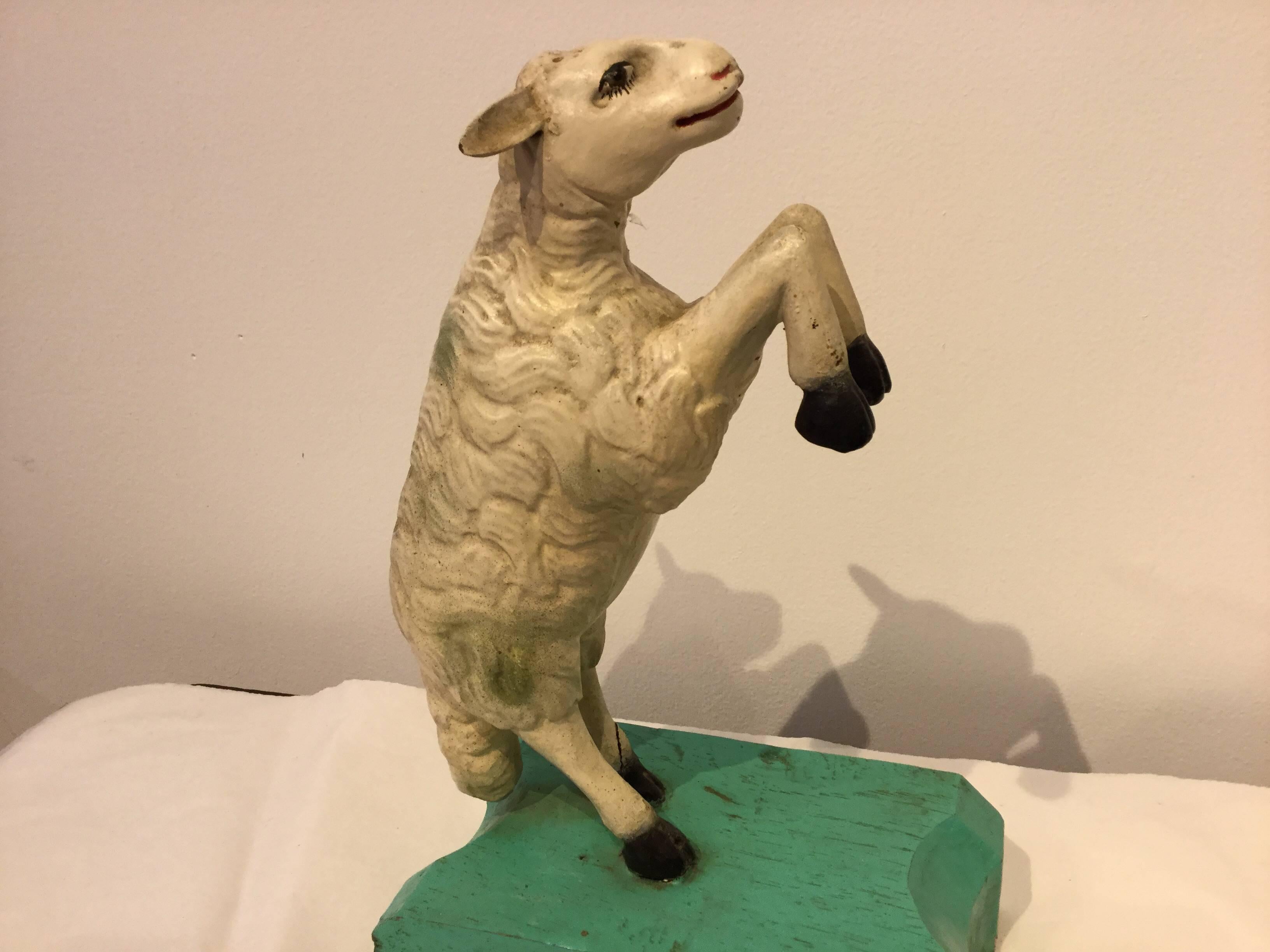 Carved wooden crèche figure Lamb or Sheep. Unusual pose, circa 1930. The Folk Art carvings of animals for crèche scenes are not as well-known as the Santos carvings, but are wonderful examples of devotional Folk Art.