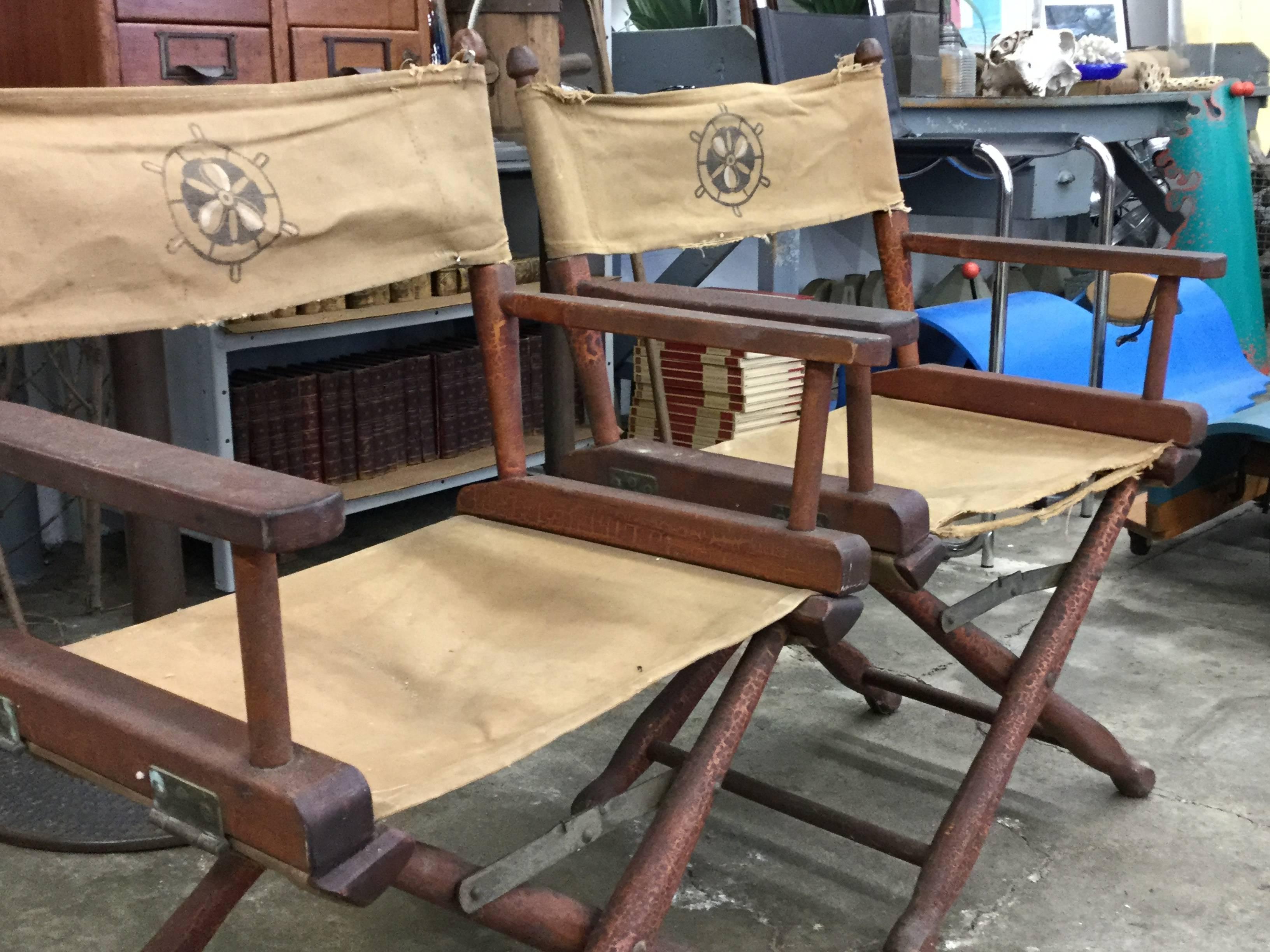 Pair of vintage deck chairs original canvas with nautical design. Came off an old sailboat in Warren, Rhode Island. They've been on the boat since circa 1962. And they look it. Can't fake this great patina!