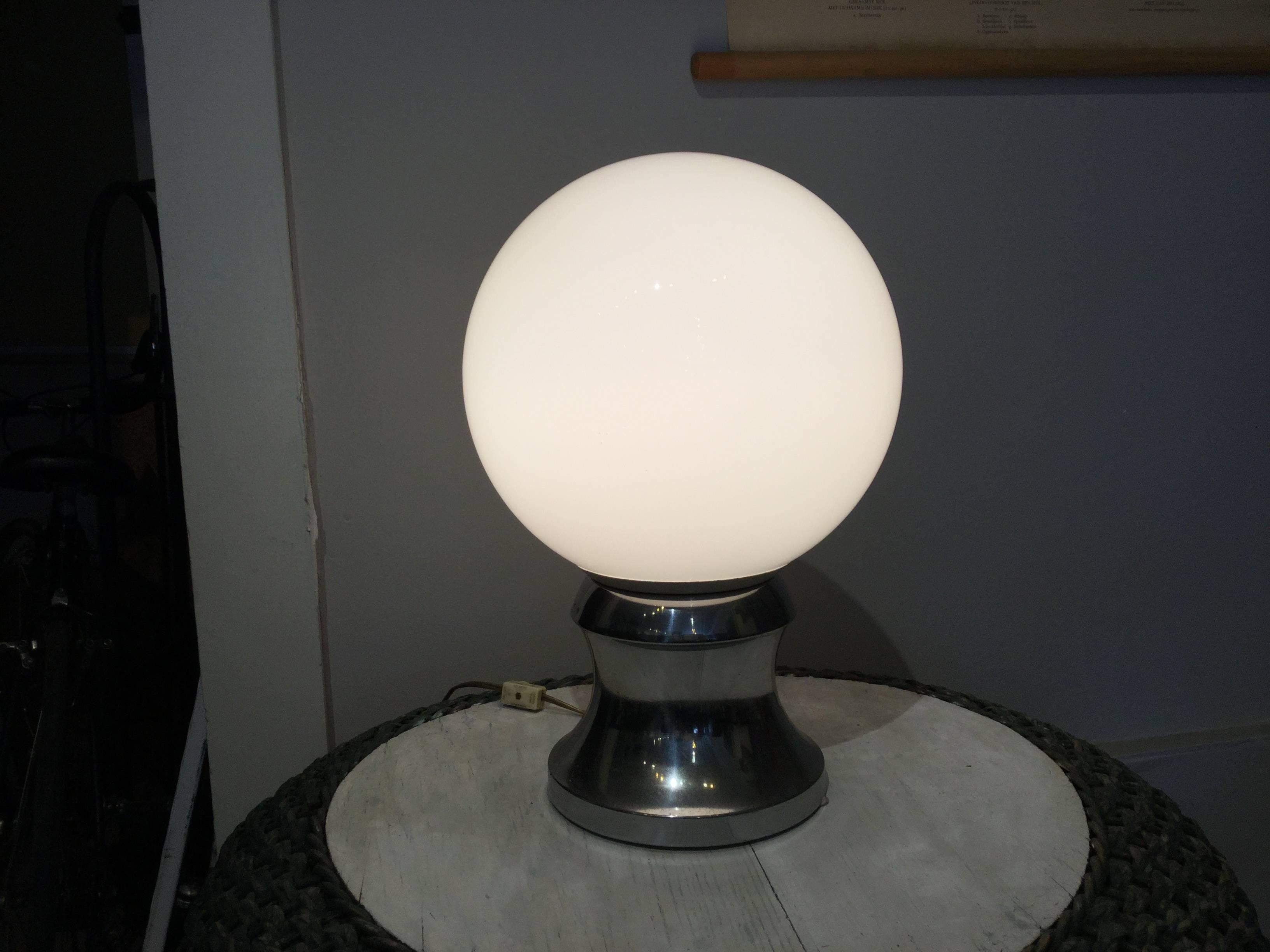Mid-Century glass globe table lamp. Never seen of of these before. It's an interesting piece with a chrome base and switch on the cord. Looks great on a table!