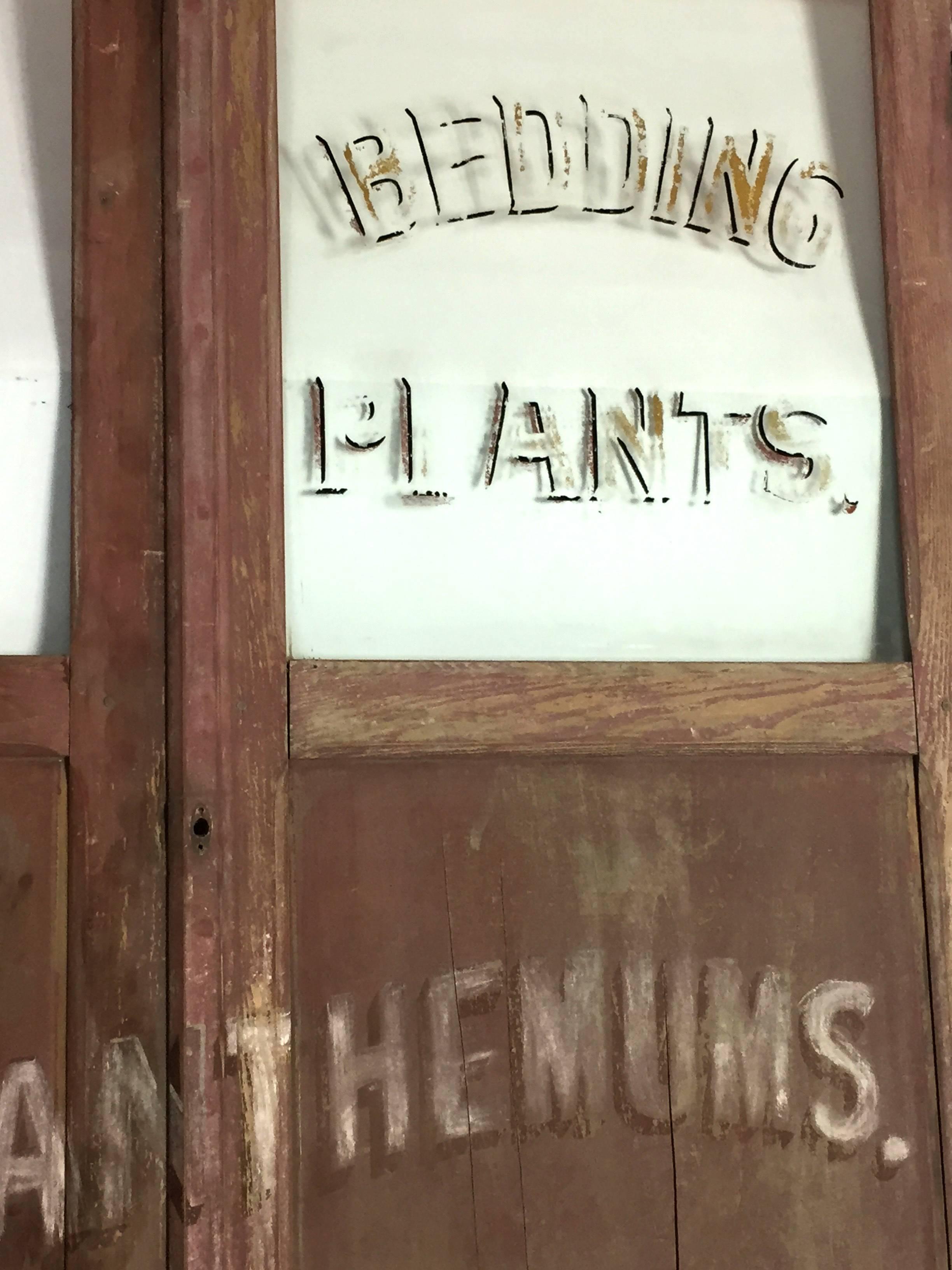 American sign on old red painted half doors, circa 1890. All original Paint. These half size doors come from inside the flower shop. Not a traditional format for an old American Trade Sign but much more interesting than many. The doors become