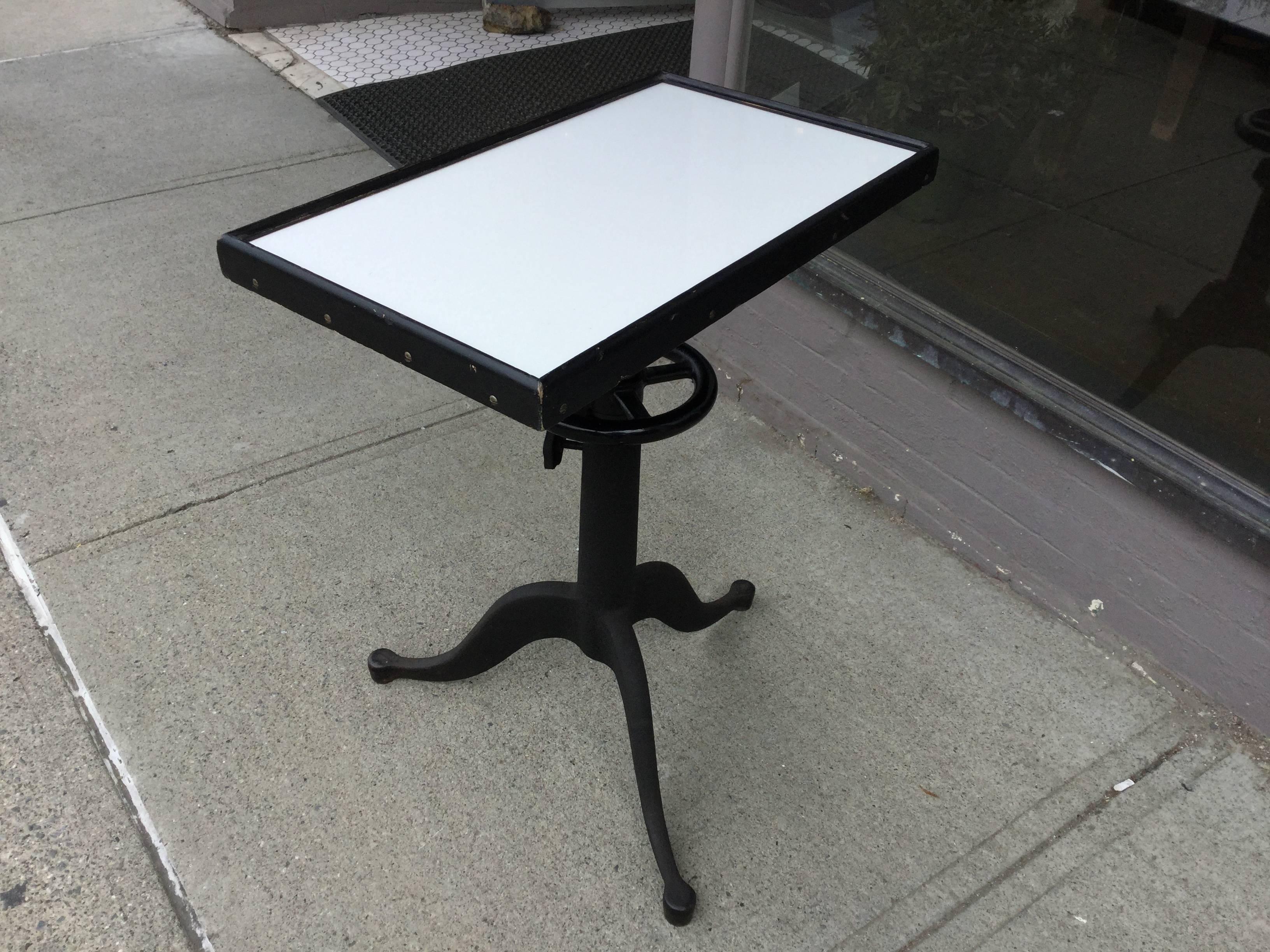 Industrial optometrist adjustable table. Made by Bausch and Lomb. All original almost pristine condition paint and milk glass surface.