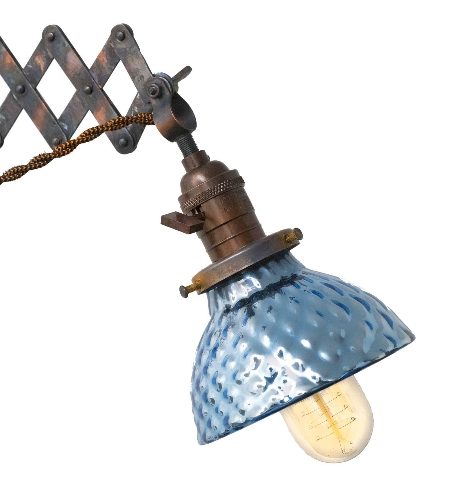 Japanned small-scale brass scissor lamp. Completely re-wired with new cord, switch and socket interior. Blue mercury glass shade is the small-scale globe (measure: approximately 5" diameter), with a piece chipped off behind the fitter.