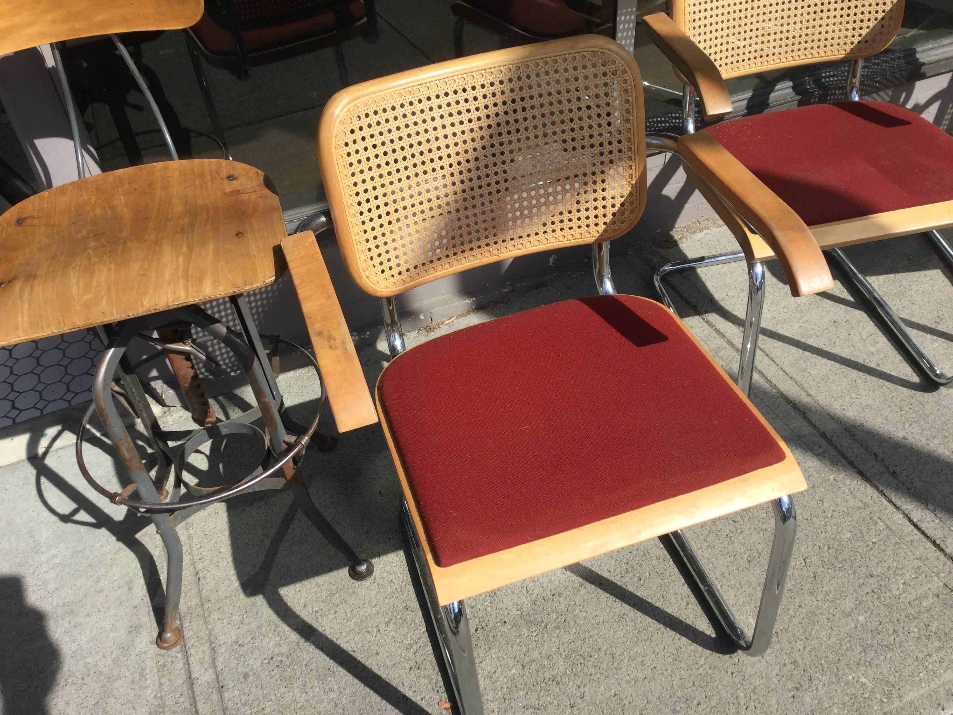 8 Mid Century Modern Marcel Breuer Chairs made by Thonet. All chairs are marked Thonet and red fabric is original.  All chairs have wear. 