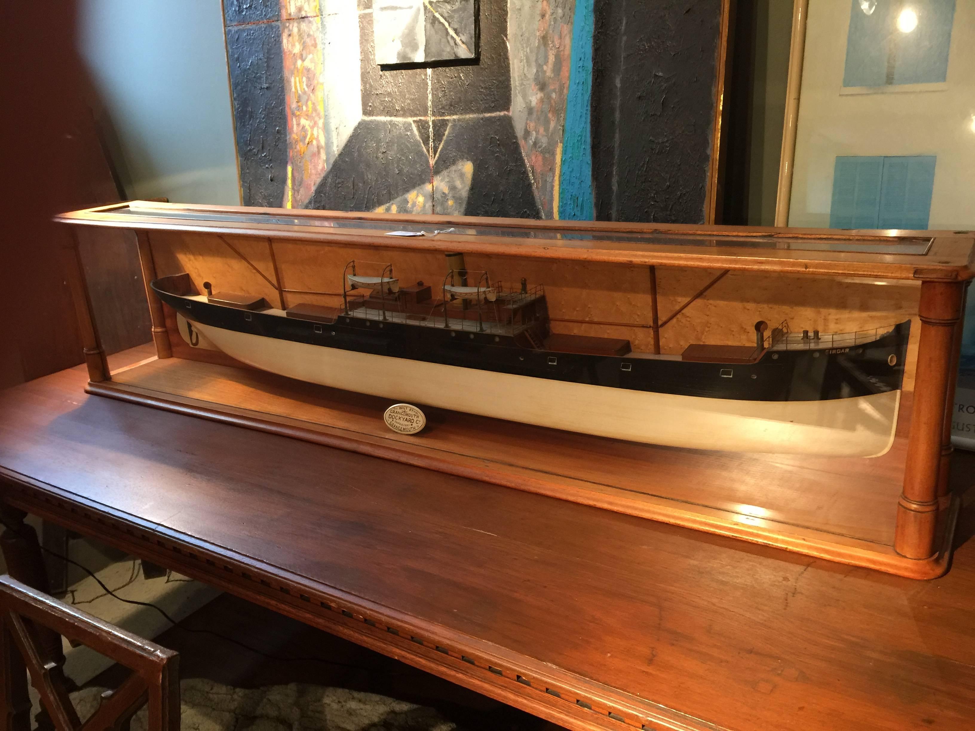 Large steamship model in beautiful case. 5 feet 8 inches long. Beautifully carved and painted nautical model in glass case.