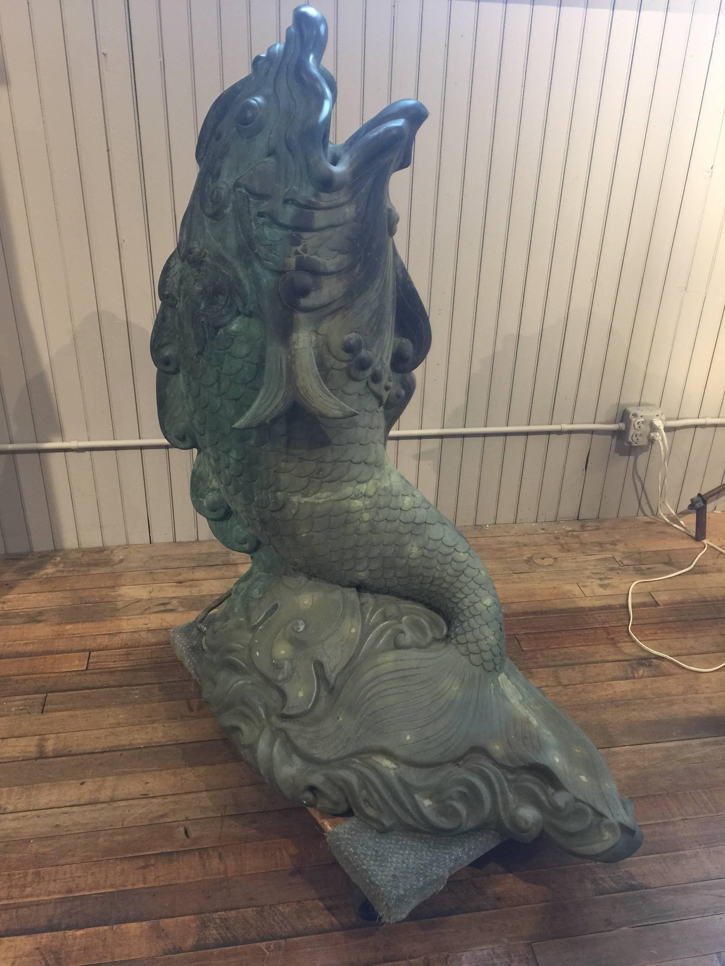 Large fish or dolphin fountain. Beautiful verdigris patina. The water comes from the mouth of the fish. Very strong and elegant piece, that would look great in any garden setting.