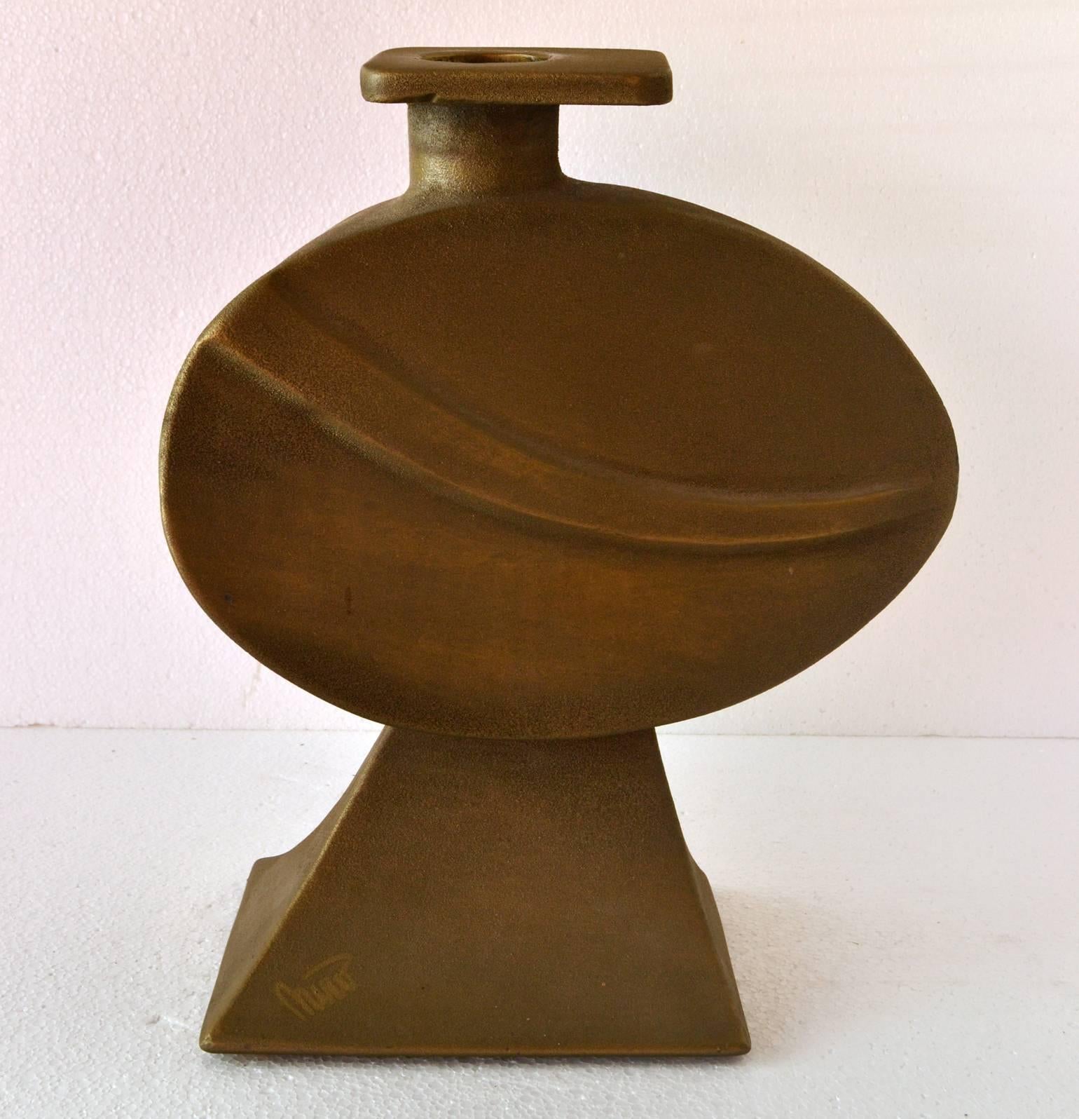 Brutalist large flat belly vessel with a rough sandblasted texture for in or out door use. The bronze vase is different from every angle you look at it. The foot and neck are incorporated in the design and the heavy bronze cast vase signed Nuro is