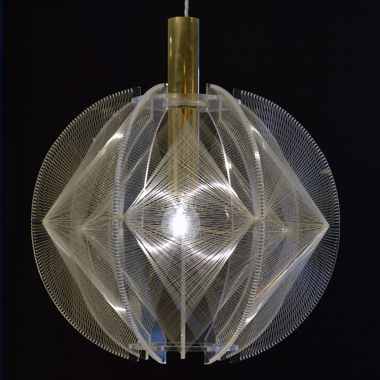 Sculptural lamp made of clear perspex and transparent wire accompanied brass internal fittings by Paul Secon for Sompex. The design is influenced by the pioneer, Avant Garde artist and sculptor Naum Gabo (1890–1977). These lamps are monumental as a