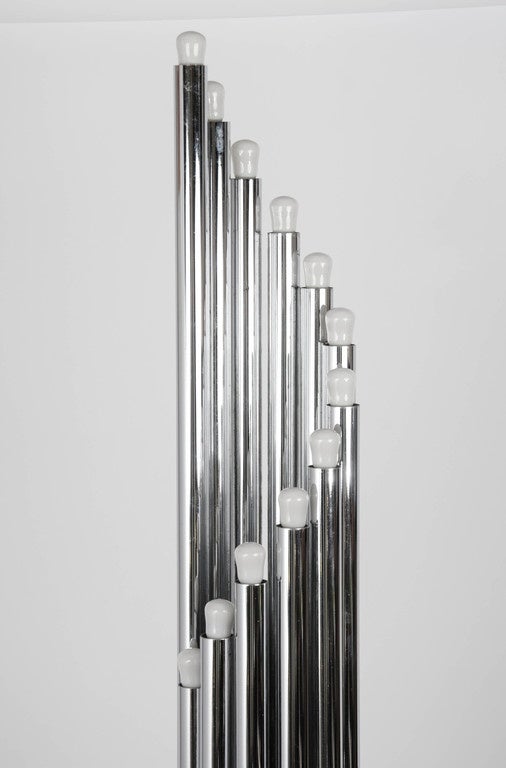 Architectural chrome tubular floor lamps with an array of ascending or descending tubular lights spiralling from a round plinth like organ pipes that are compact in design.