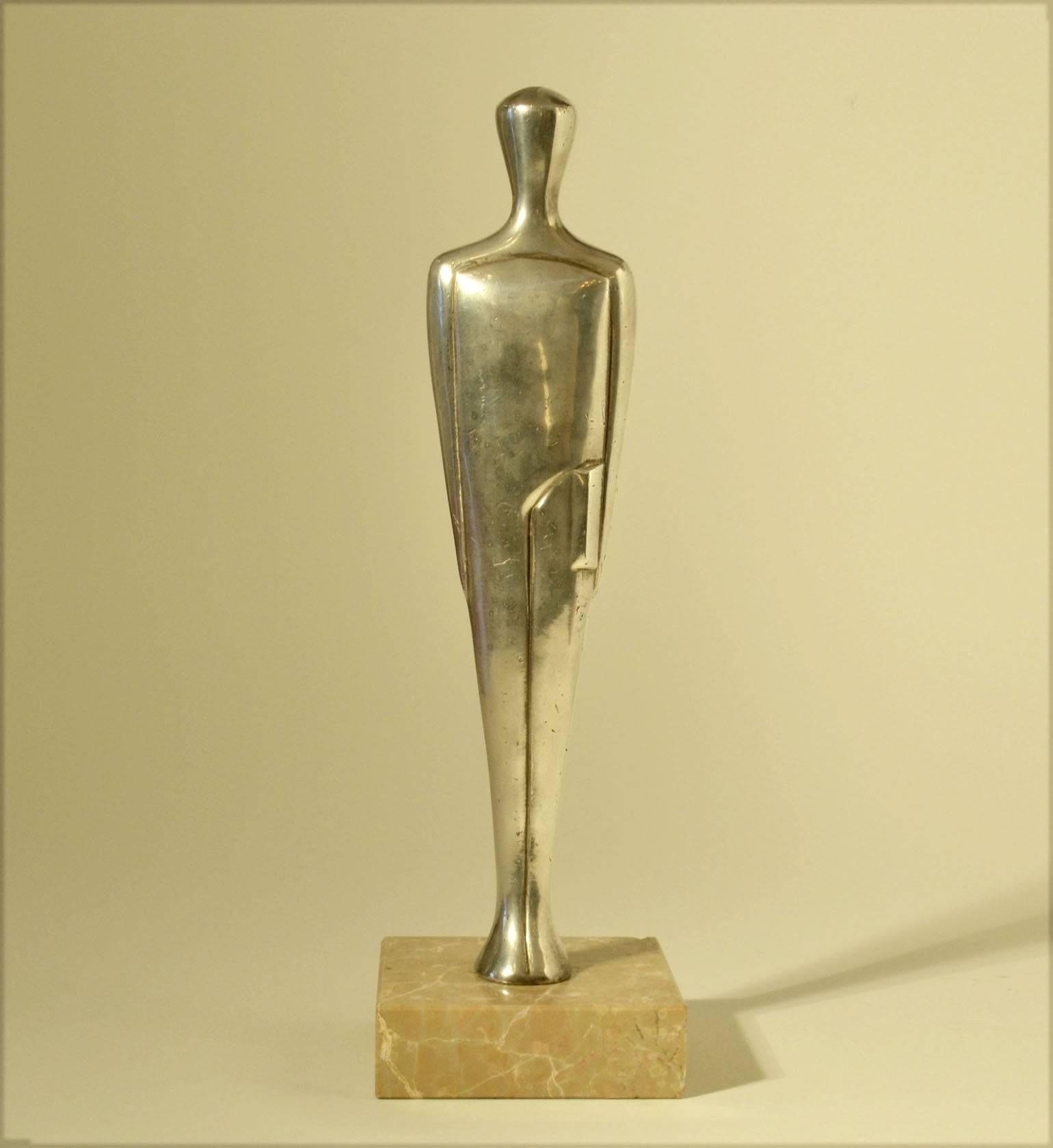 Abstract figure holding a script is cast in pewter and placed on a marble base. It is designed by the artist E. W. Lane. This Oscar type sculpture is designed around the same time as the 'real' gold-plated Oscar by Gibbons in 1938. During the same