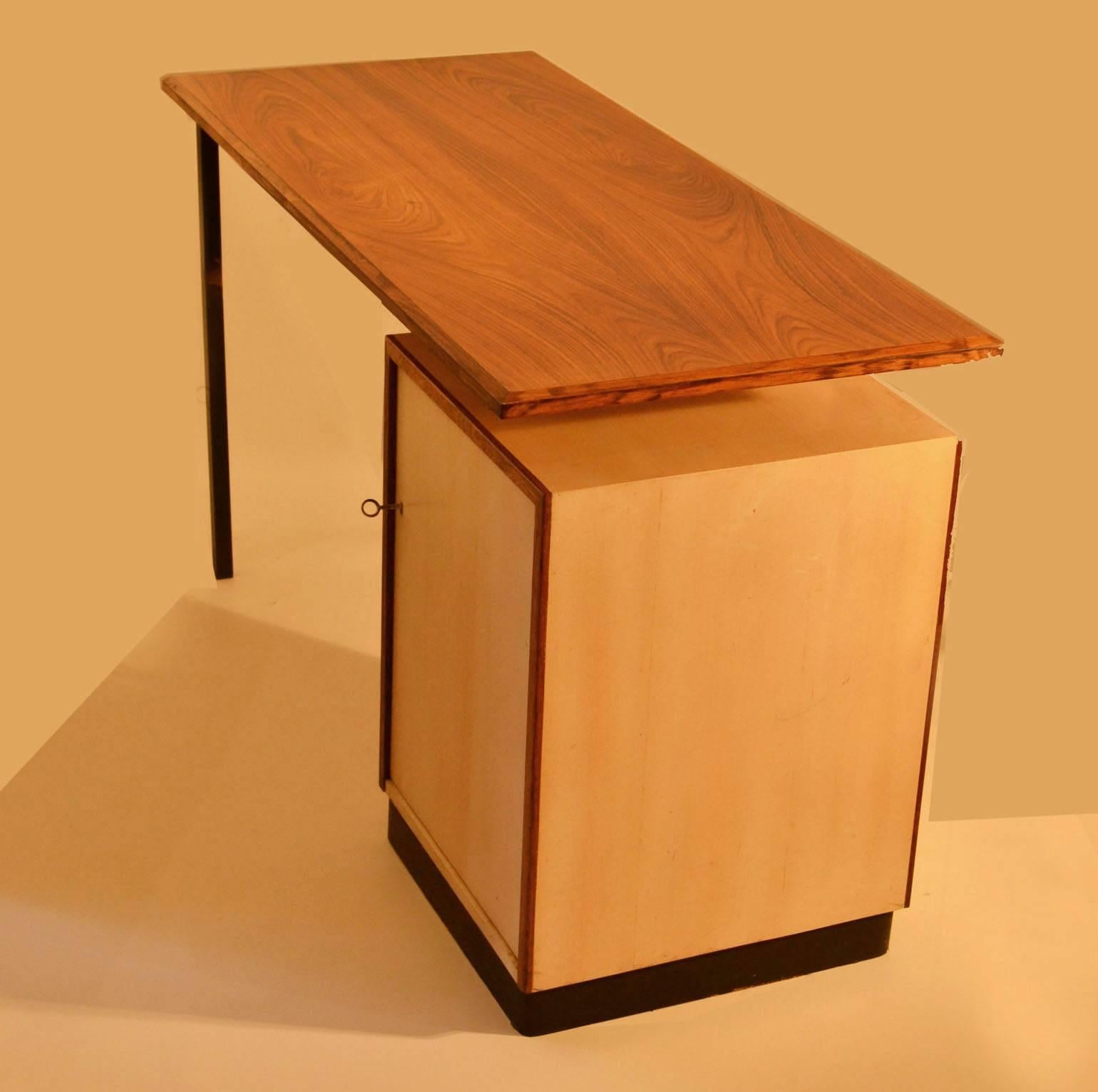 Compact desk with storage on the right and metal legs on the left side has a rosewood top with bevelled edges. The boxed storage section is in birchwood edged with rosewood, inside there are four pull-out draws.
 