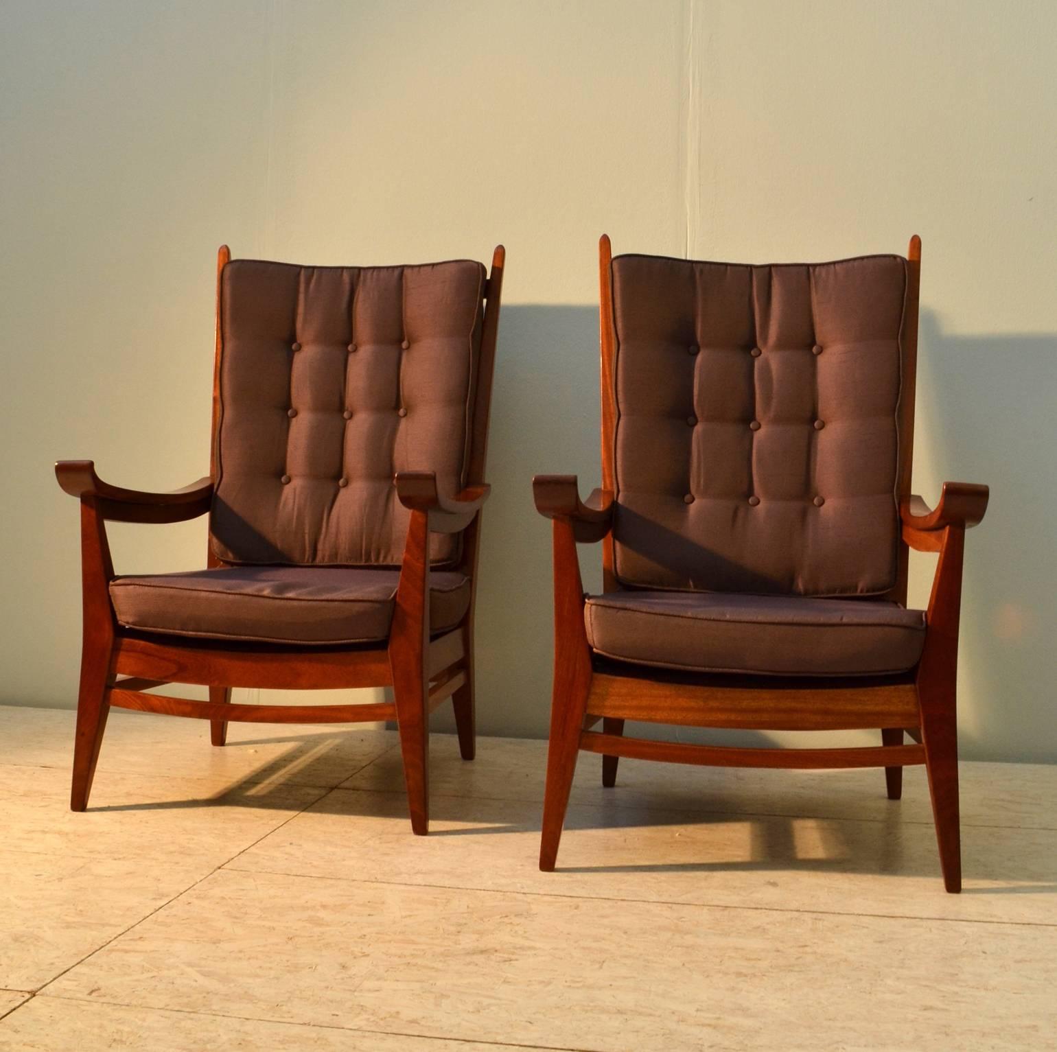 Mahogany framed handcrafted high back slatted chairs with real character. The button cushioned seats and backs are re upholstered in a warm tone high quality silk that matches well with the orange brown wood. The throne like chairs arm rests curve
