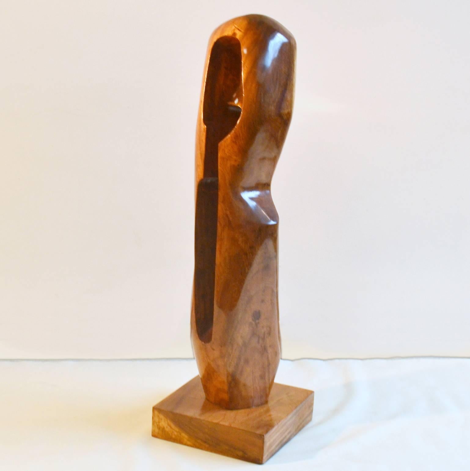 Large Mahogany wooden sculpture in curvaceous abstract form by unknown artist in the style of Alexander Knoll.
The sculpture is placed on a mahogany base. It was originally stained. 
We had it stripped and polished to enjoy its wood grain and