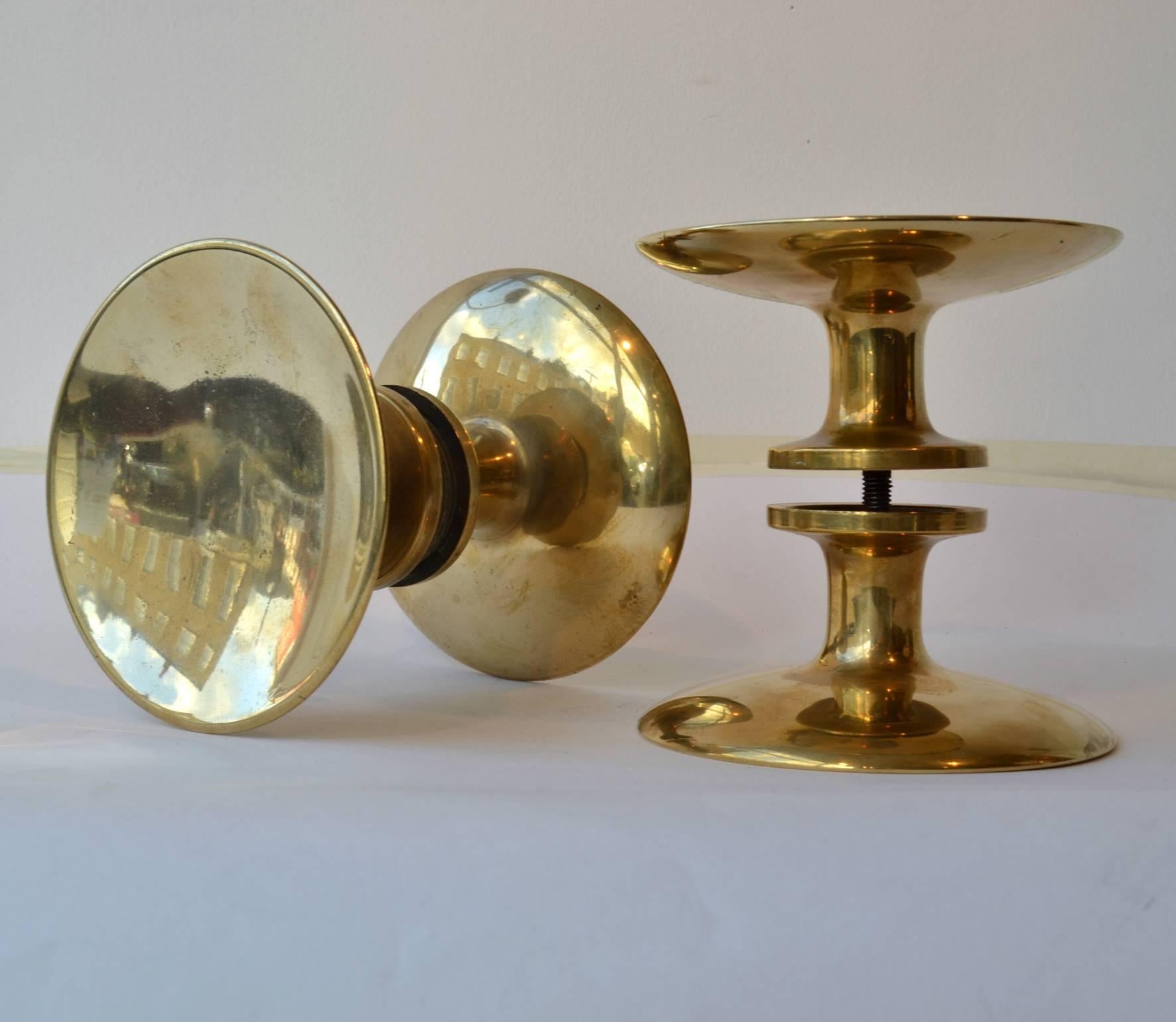 Polished gold color bronze door handles for push and pull doors in a pair.